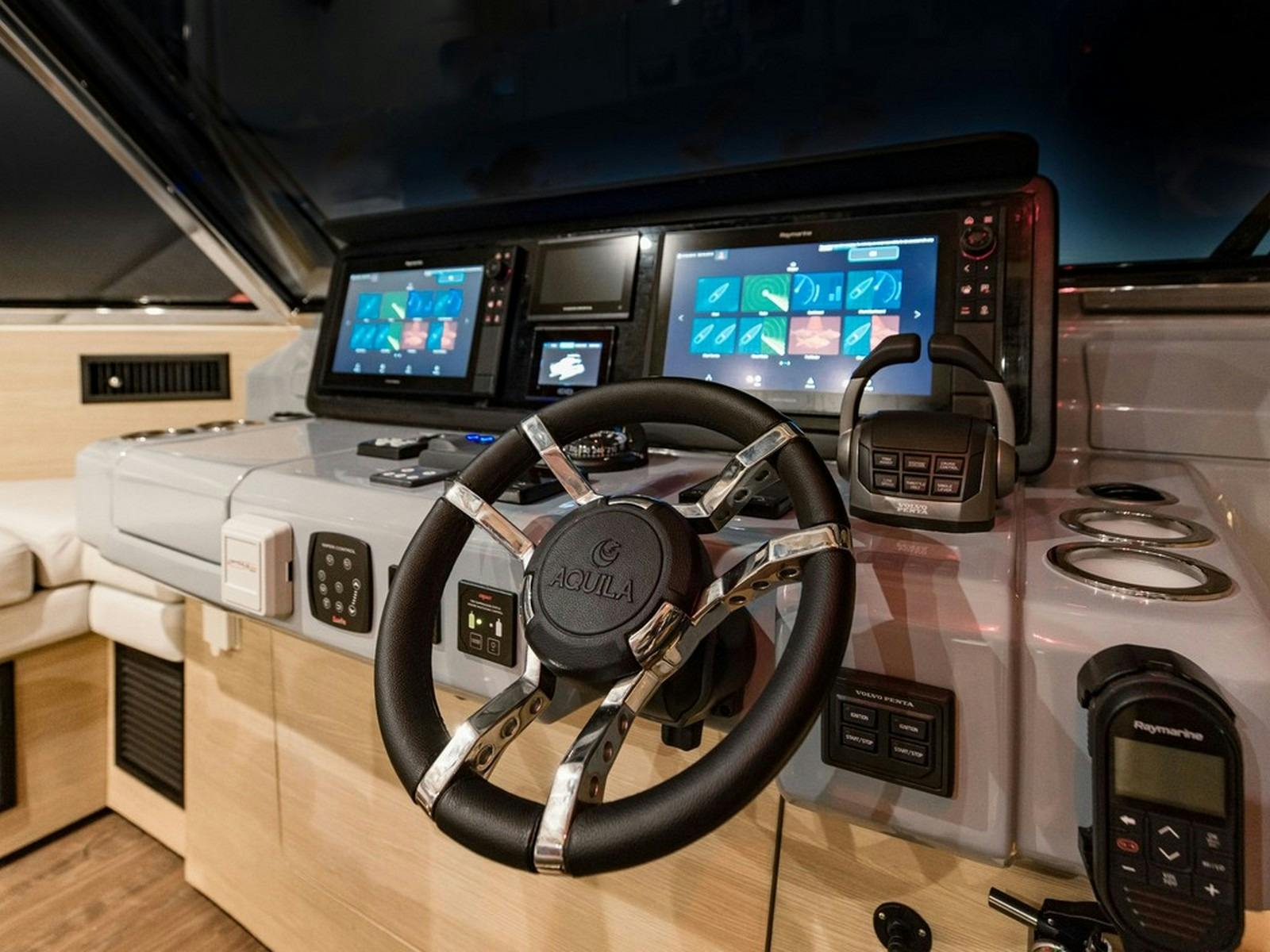 Aquila 54 - Flybridge helm at night