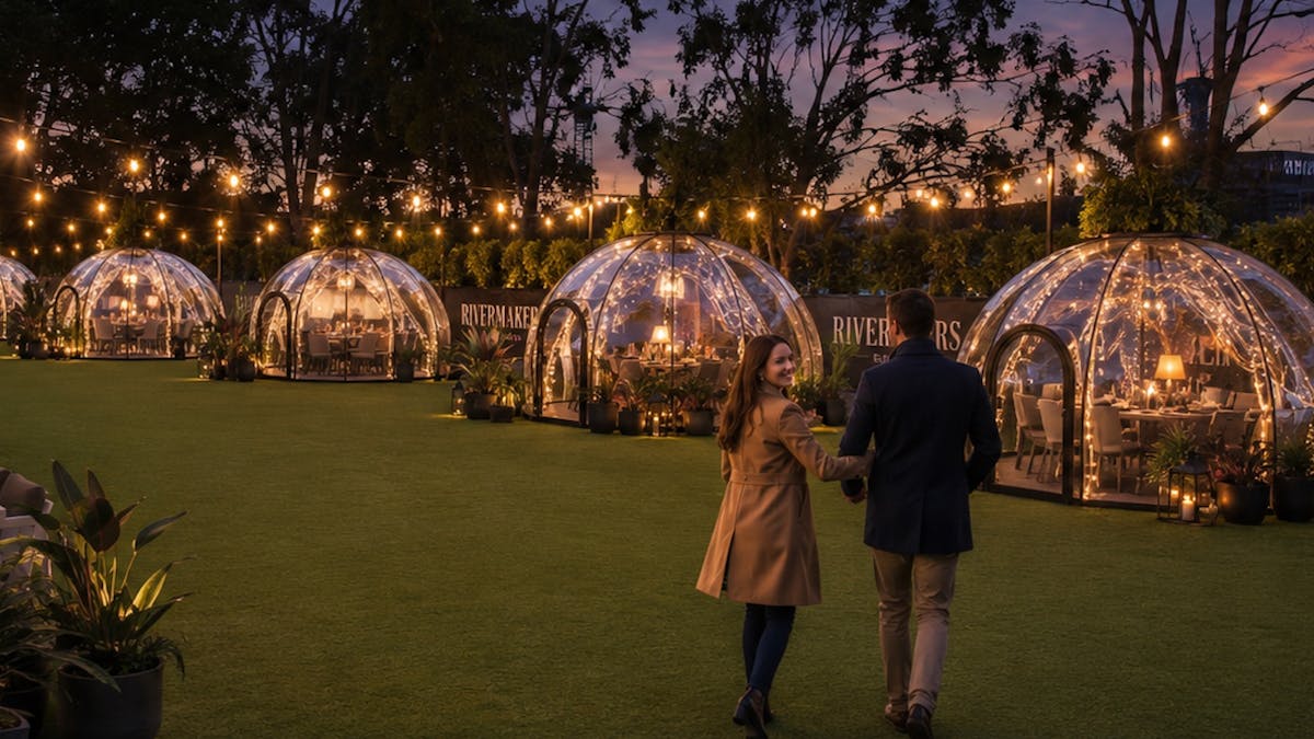 igloos outside with fairy lights and greenery around
