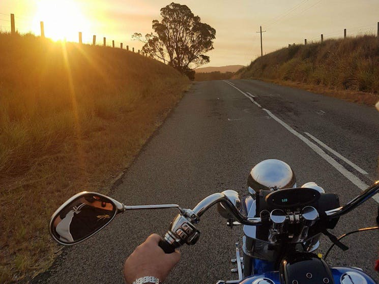 on the trike at sunset