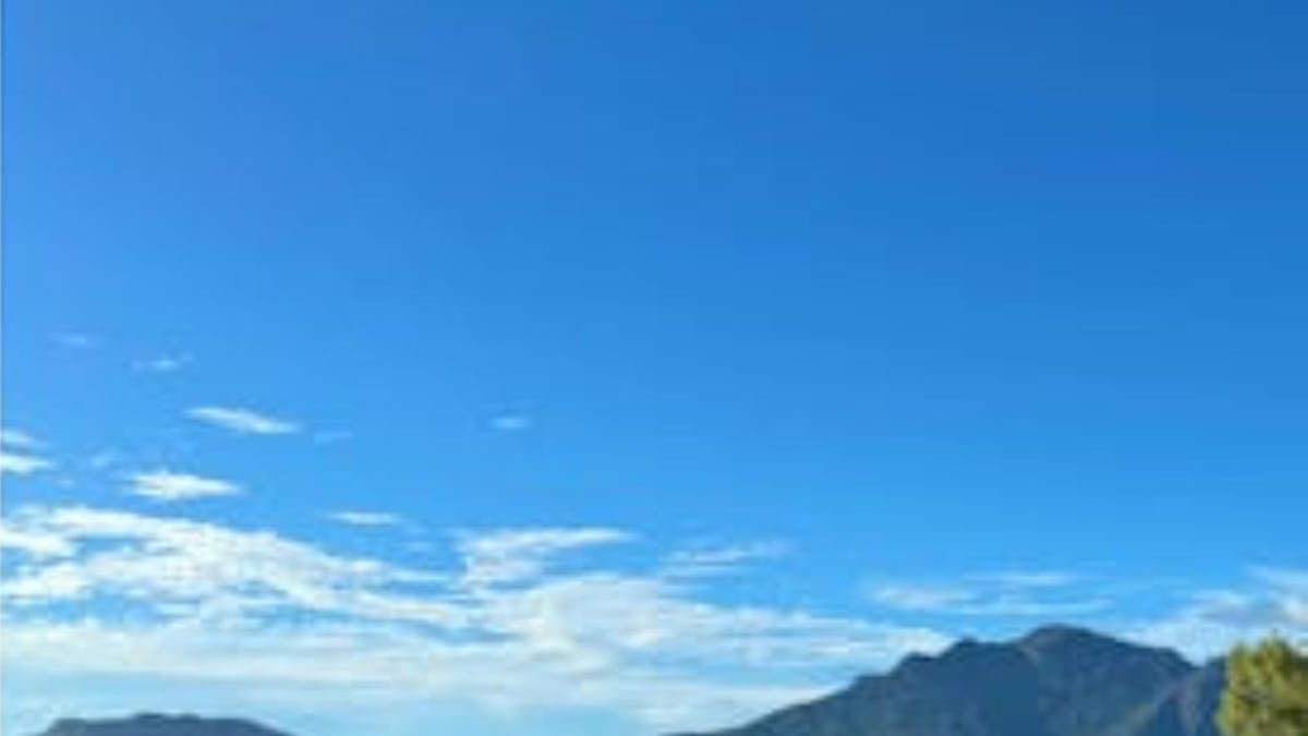 Hinchinbrook Island with blue skies and water