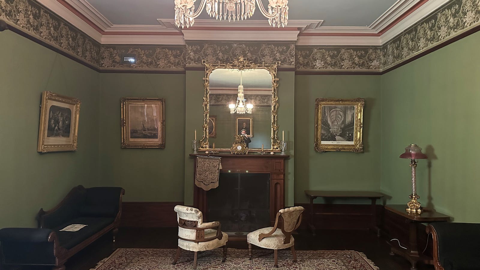 The Drawing Room at Runnymede features a magnificent bay window, ornate mirrors, and a grand piano.