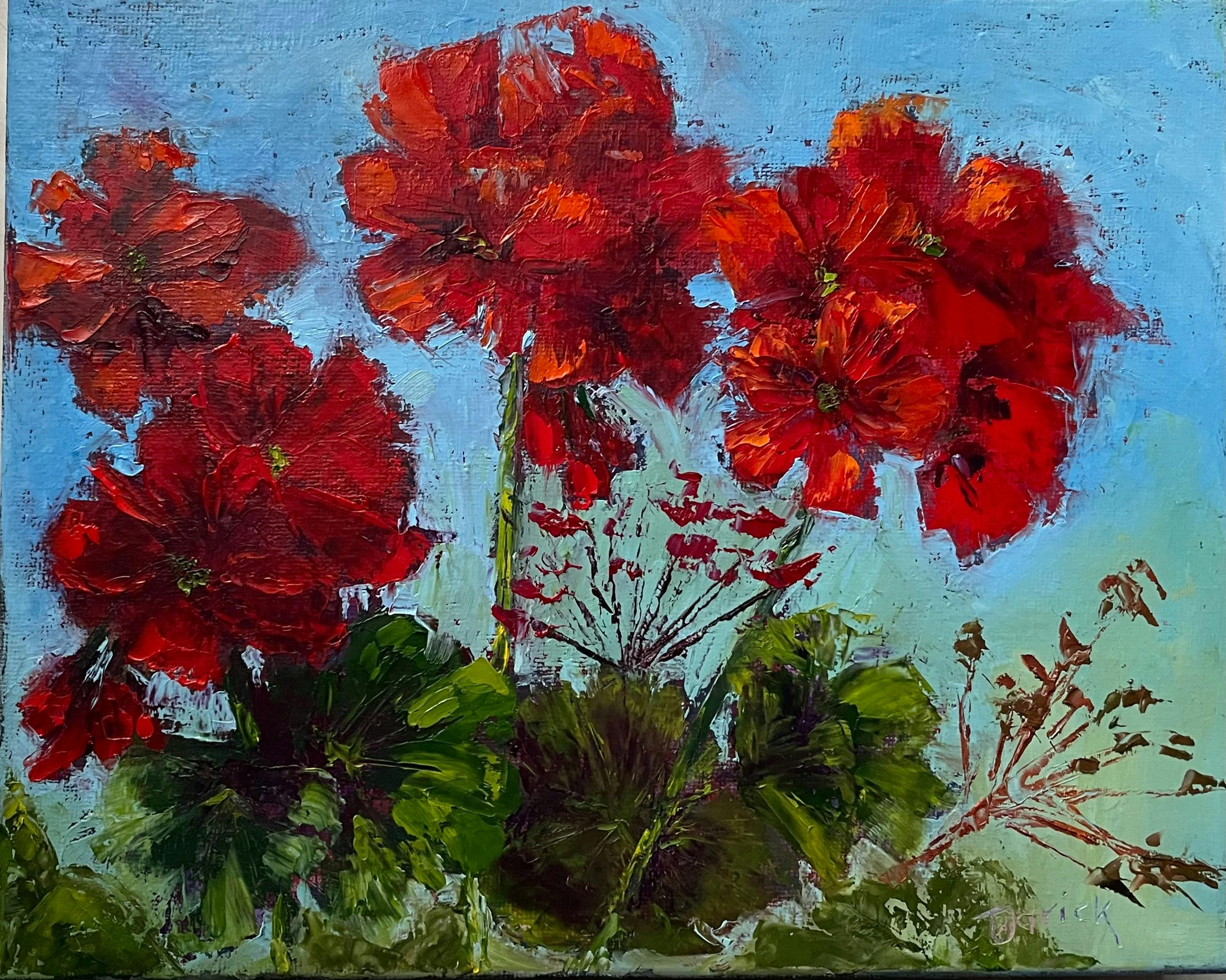 Crimson Geraniums with green leaves and a blue background