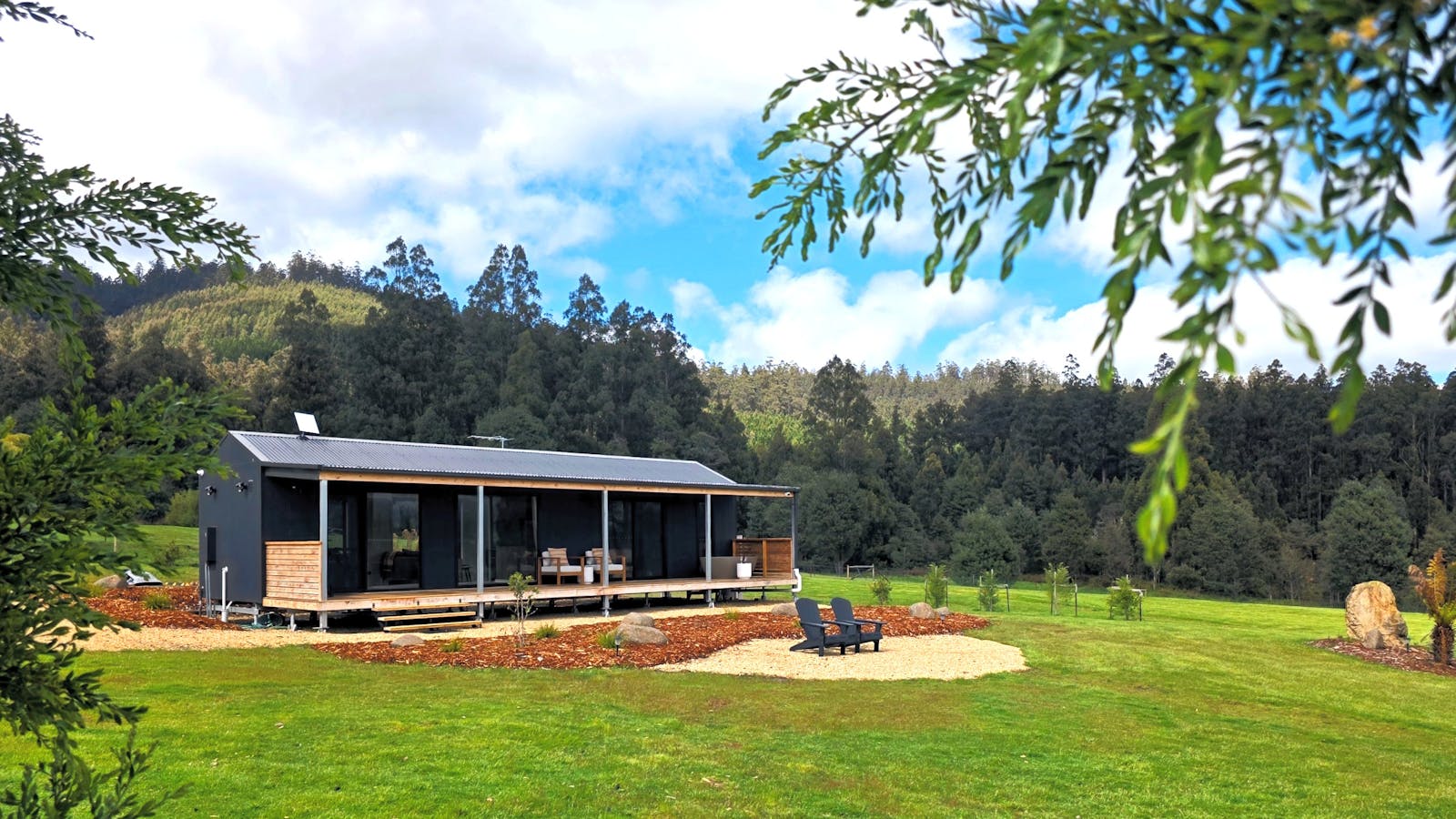 Luxury cabin on 1.7 acres with park-like grounds, forest backdrop and sweeping mountain views