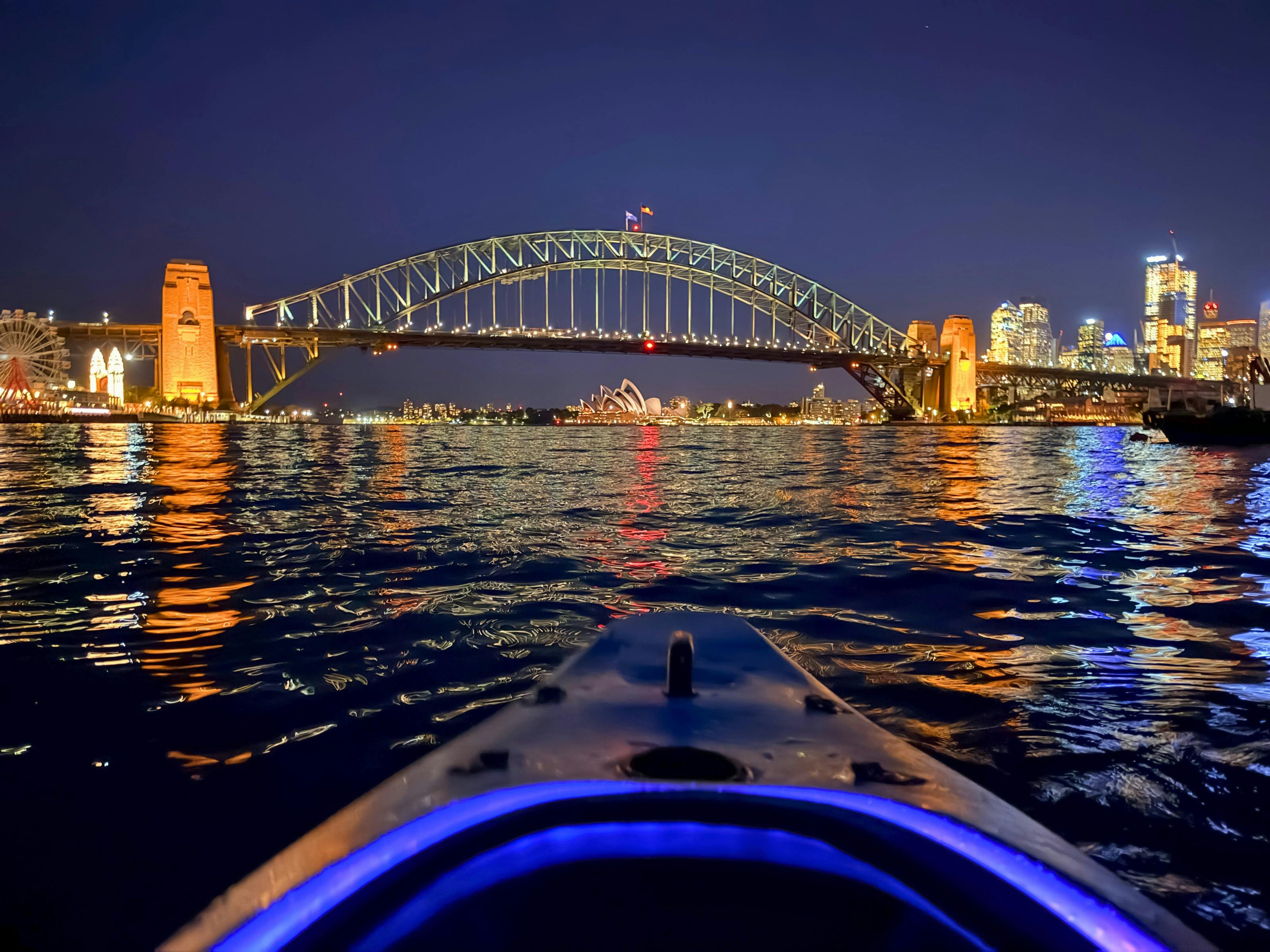 Sydney By Kayak shows a POV view of the Opera House and Harbour bridge from their Sunset Kayak Tour