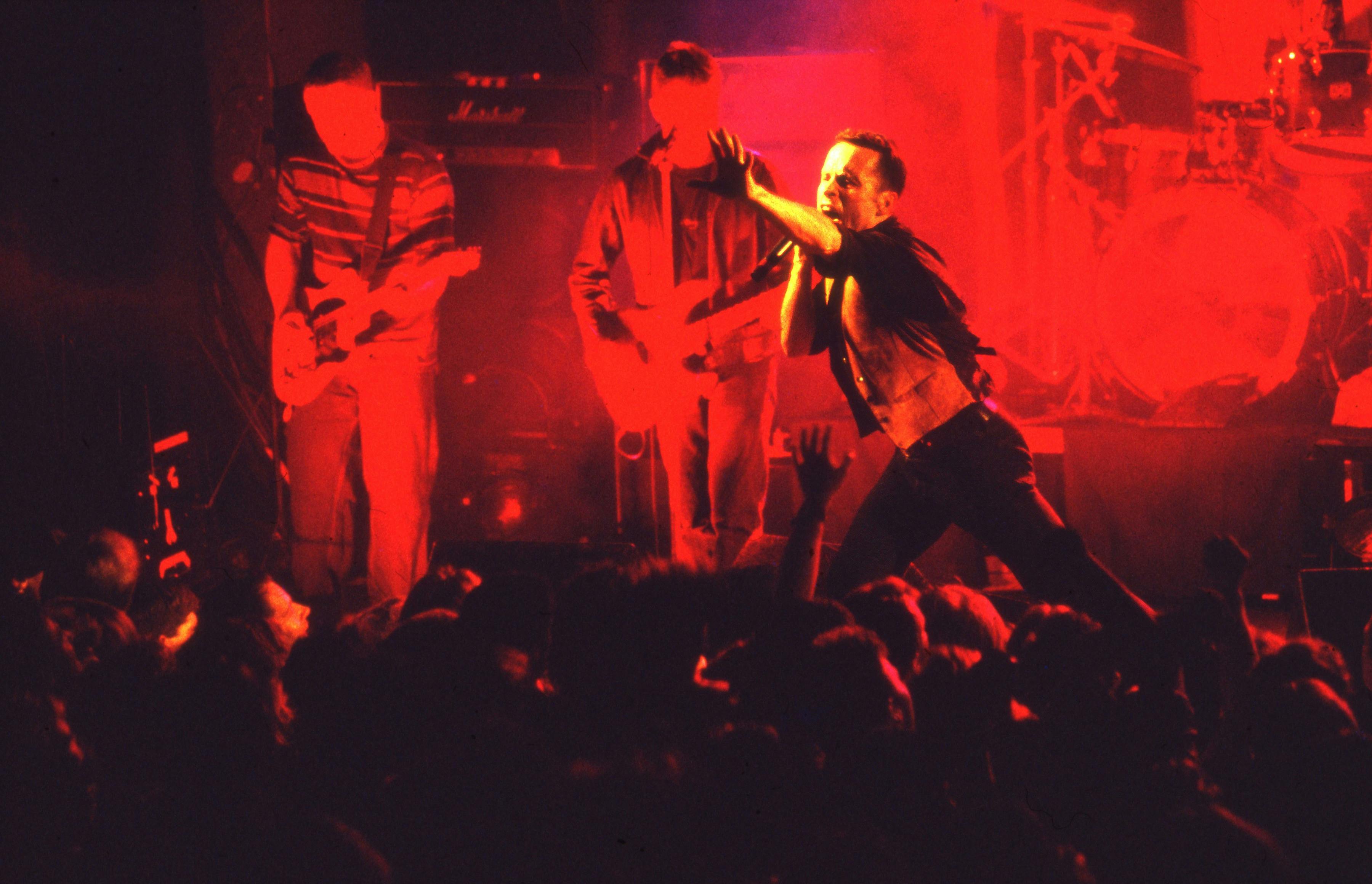band members of Hunters and Collectors performing on stage