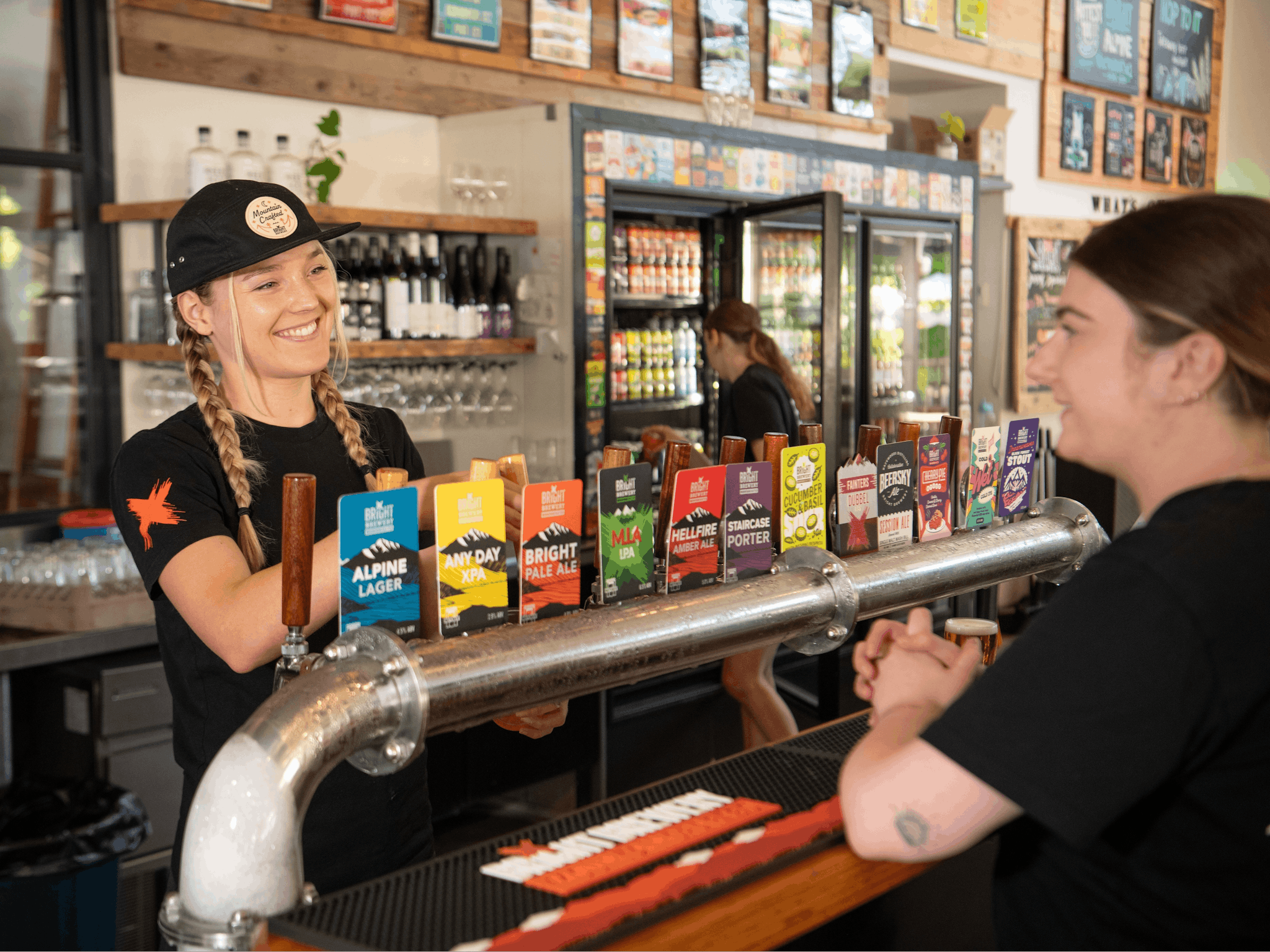 Bar tender serving a customer at the bar