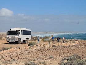 6WD coach with coastal views