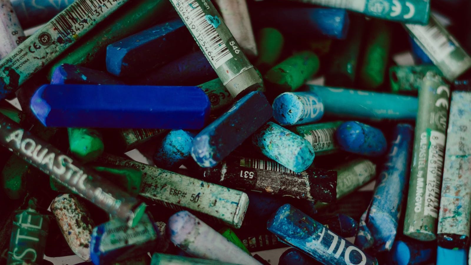 Box of blue and green crayons