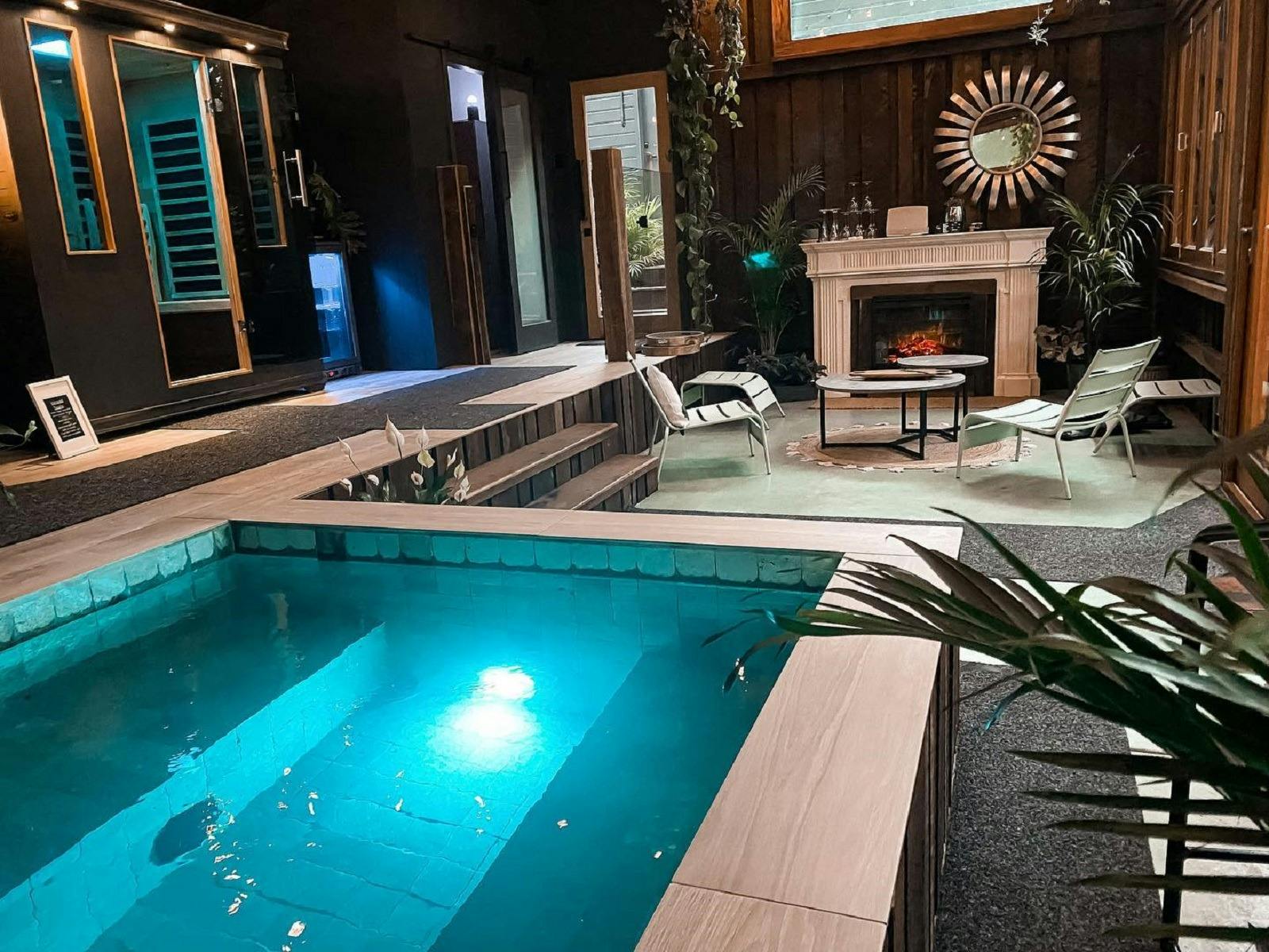 Spa room with plunge pool, fireplace, steam room and lounging area Spa room with plunge pool, fireplace, steam room and lounging area