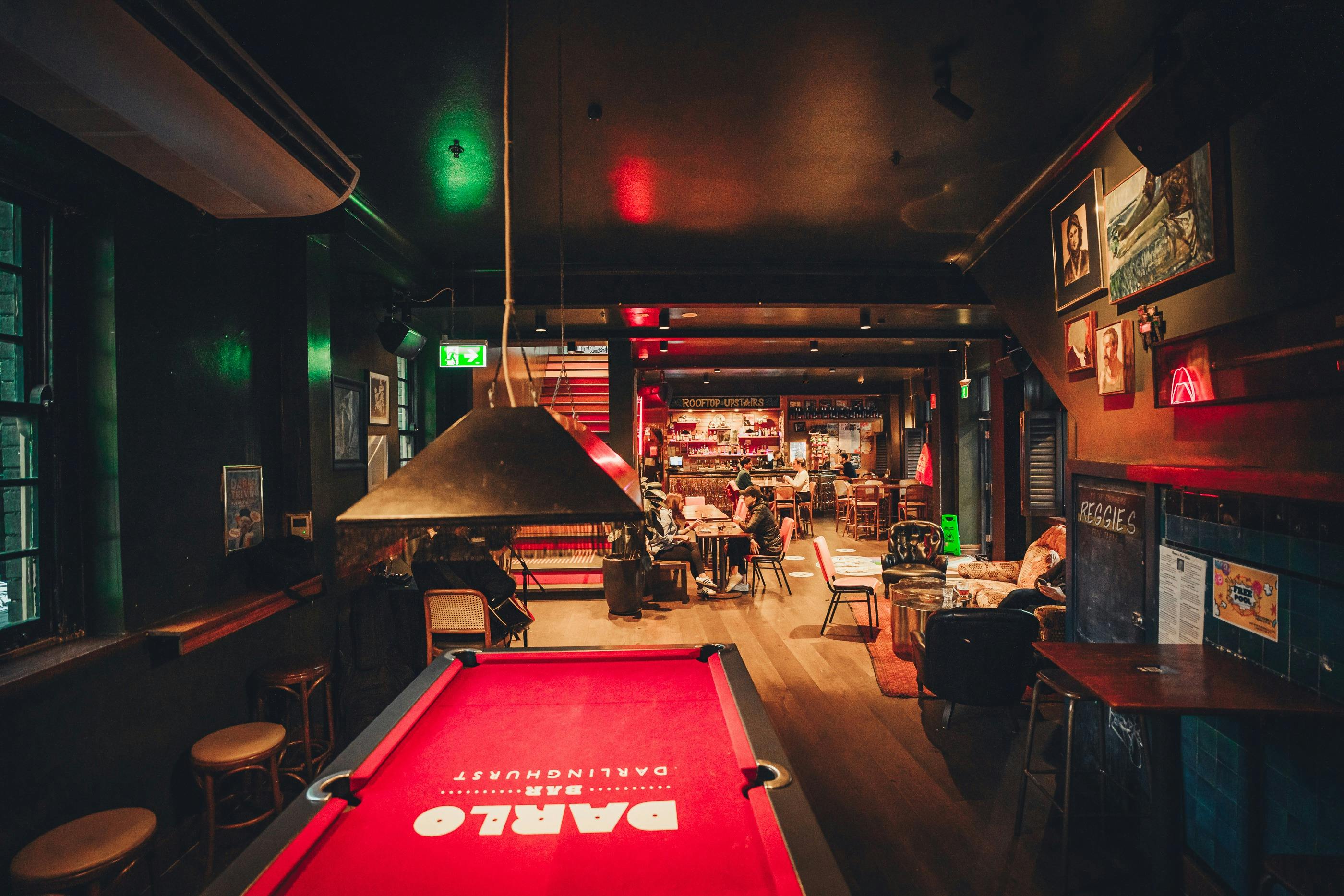 Pool table in foreground and back in background