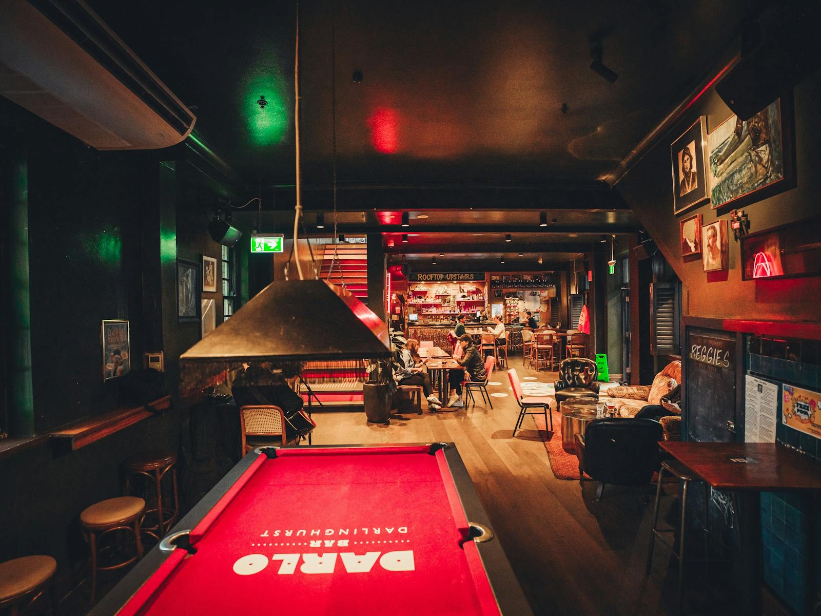 Pool table in foreground and back in background