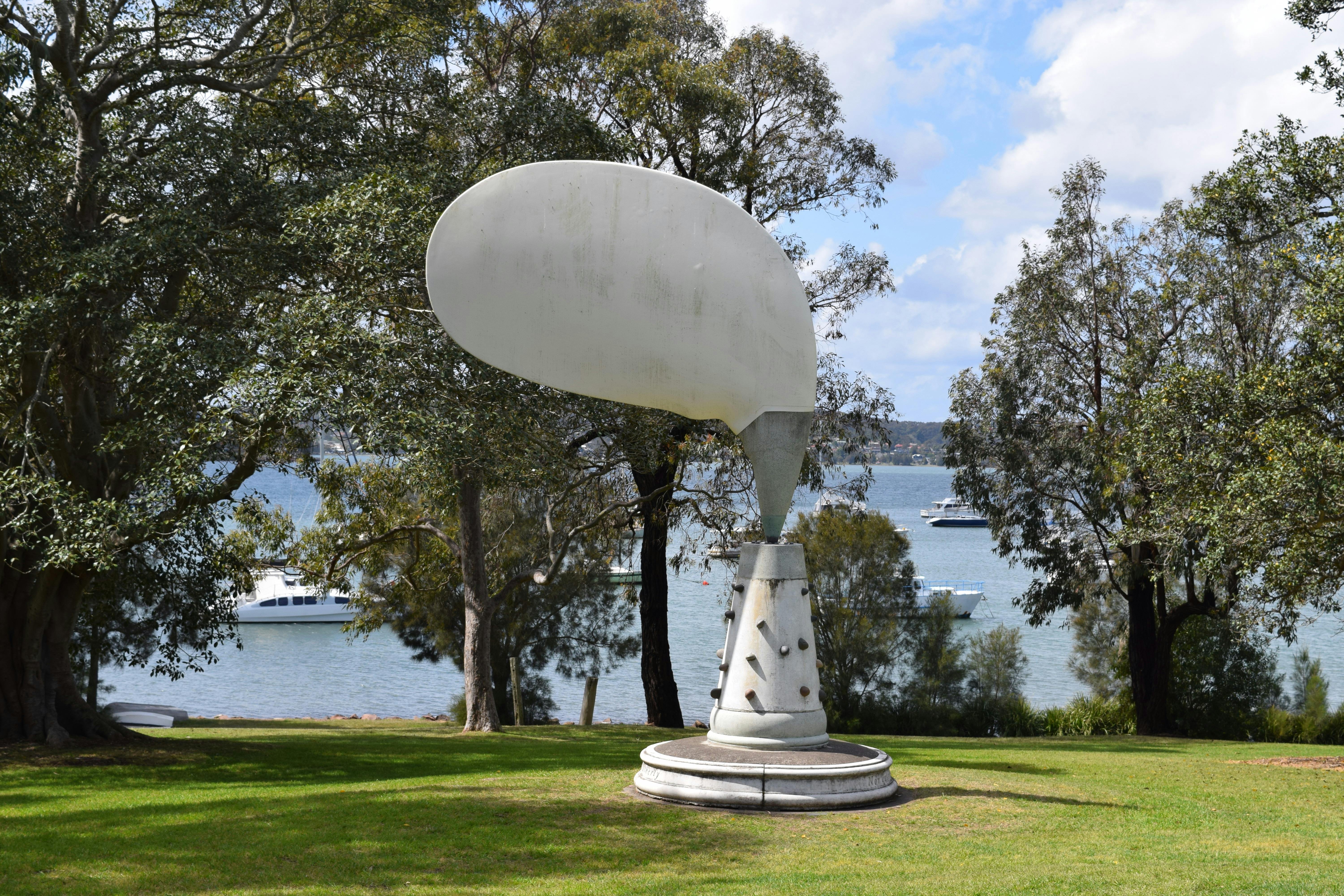 A view of John Turier's Sculpture Aeolian Tree with Lake in background