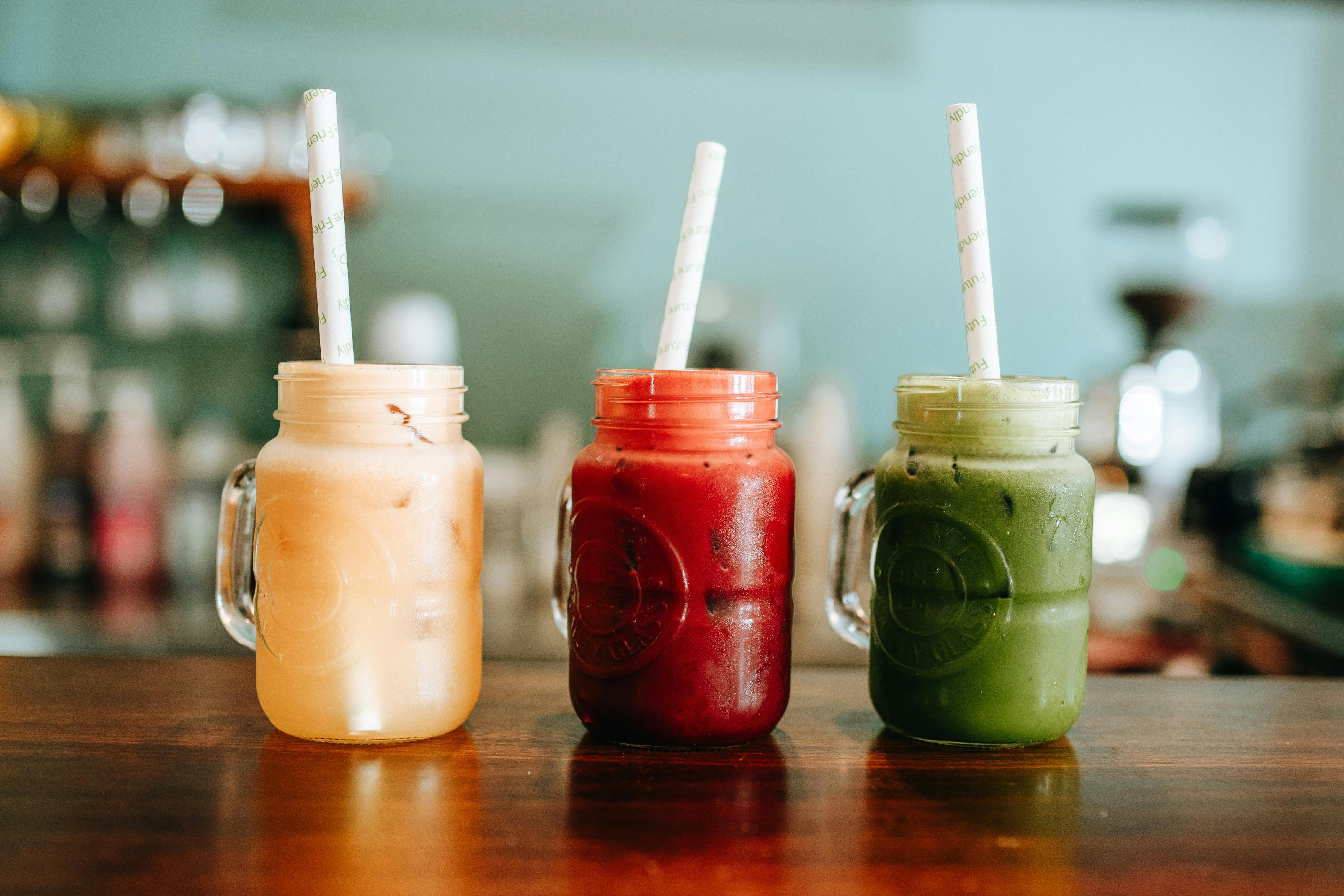 Assortment of colourful juices on countertop