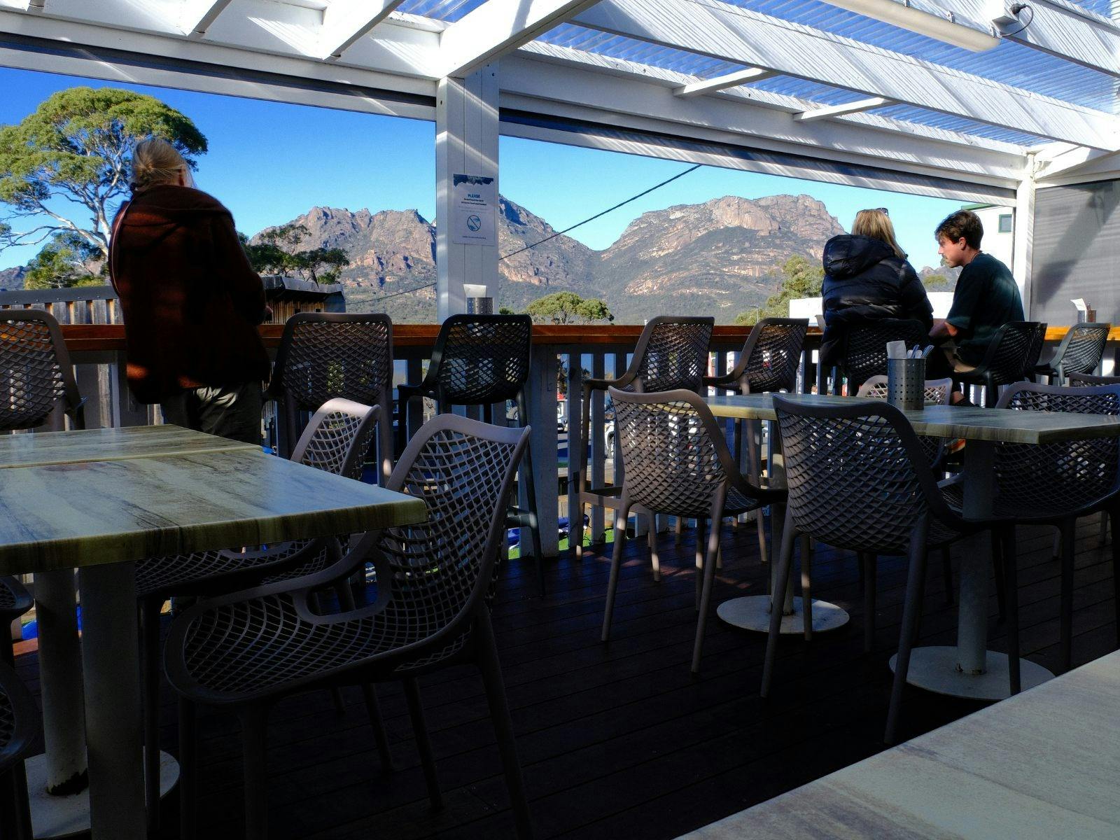Versatile dining space with indoor and alfresco seating overlooking Coles Bay