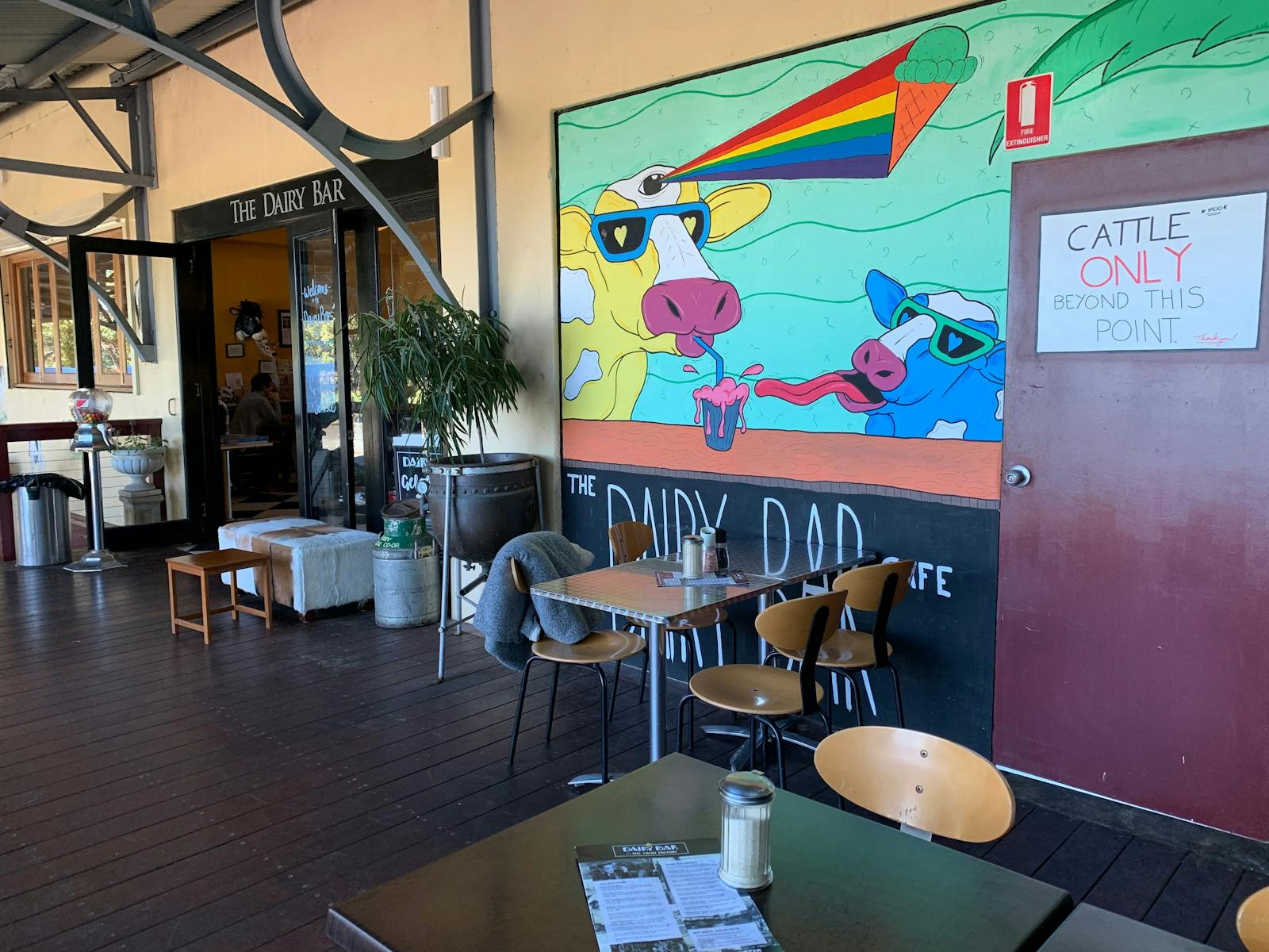 Outdoor and indoor seating at The Dairy Bar. Deck overlooking dairy pastures Berry NSW.