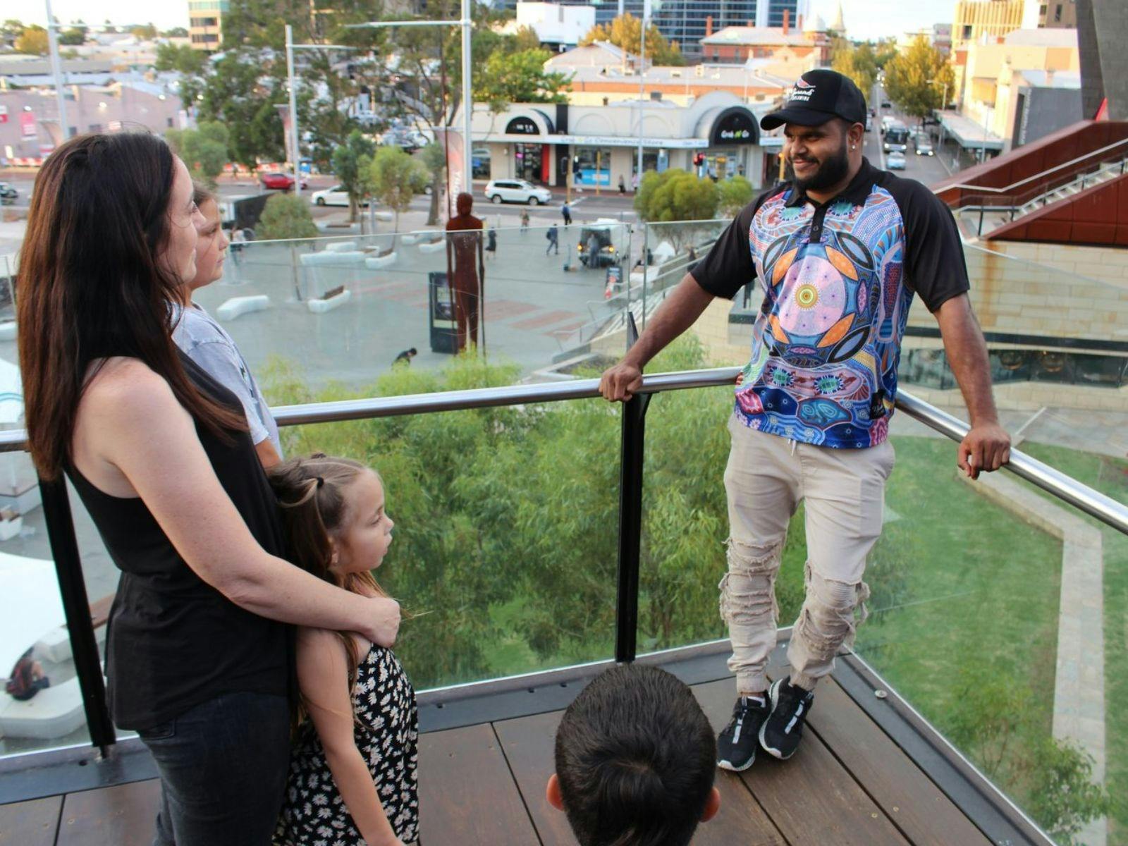 Justin talking to tourist in Yagan Square.