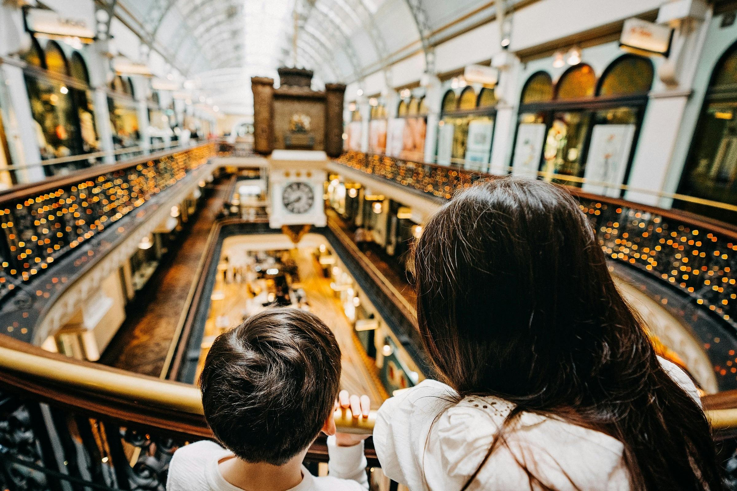 Two children on the QVB History Tour looking at the Australian Clock