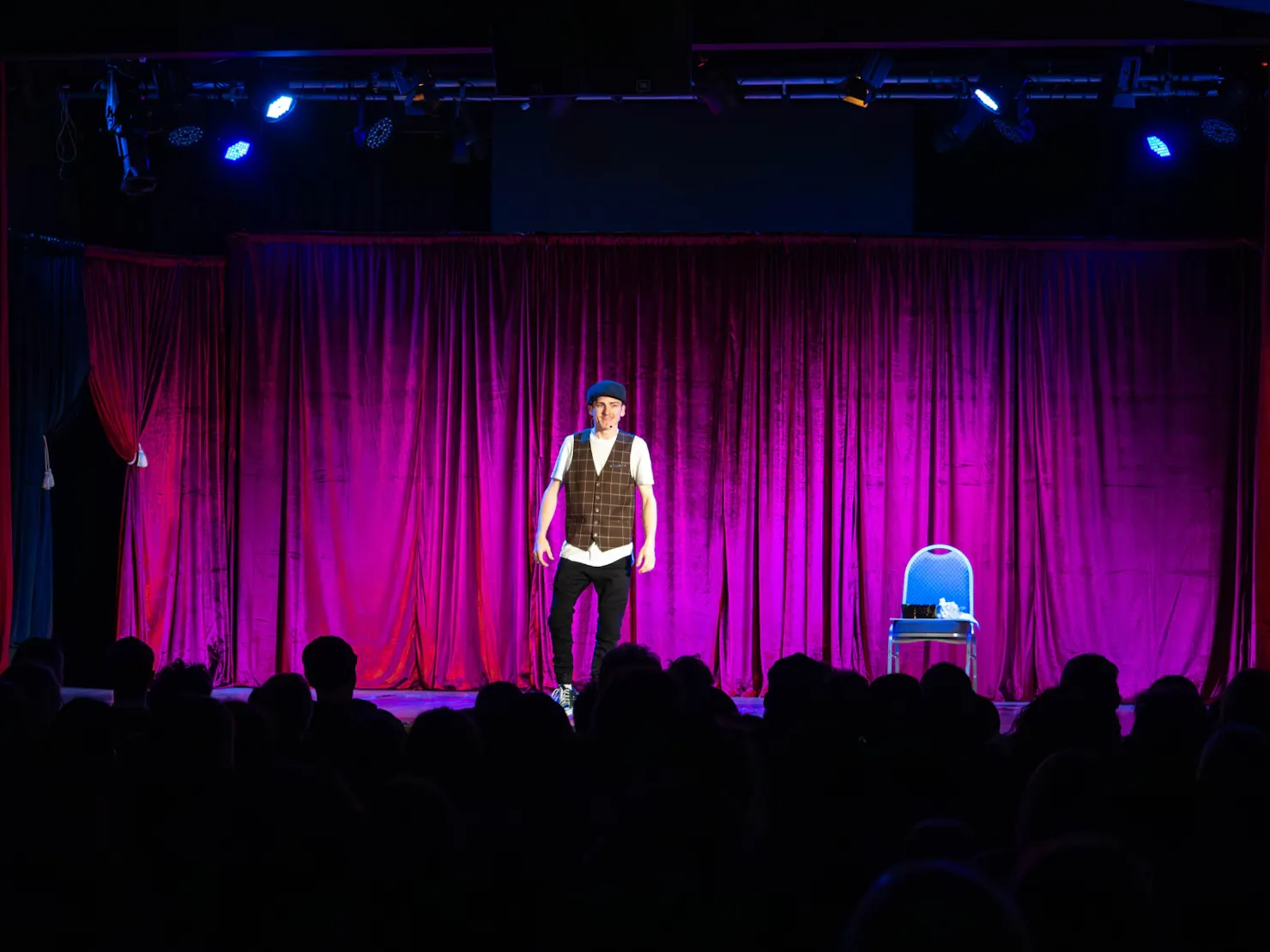 Aiden standing centre stage
