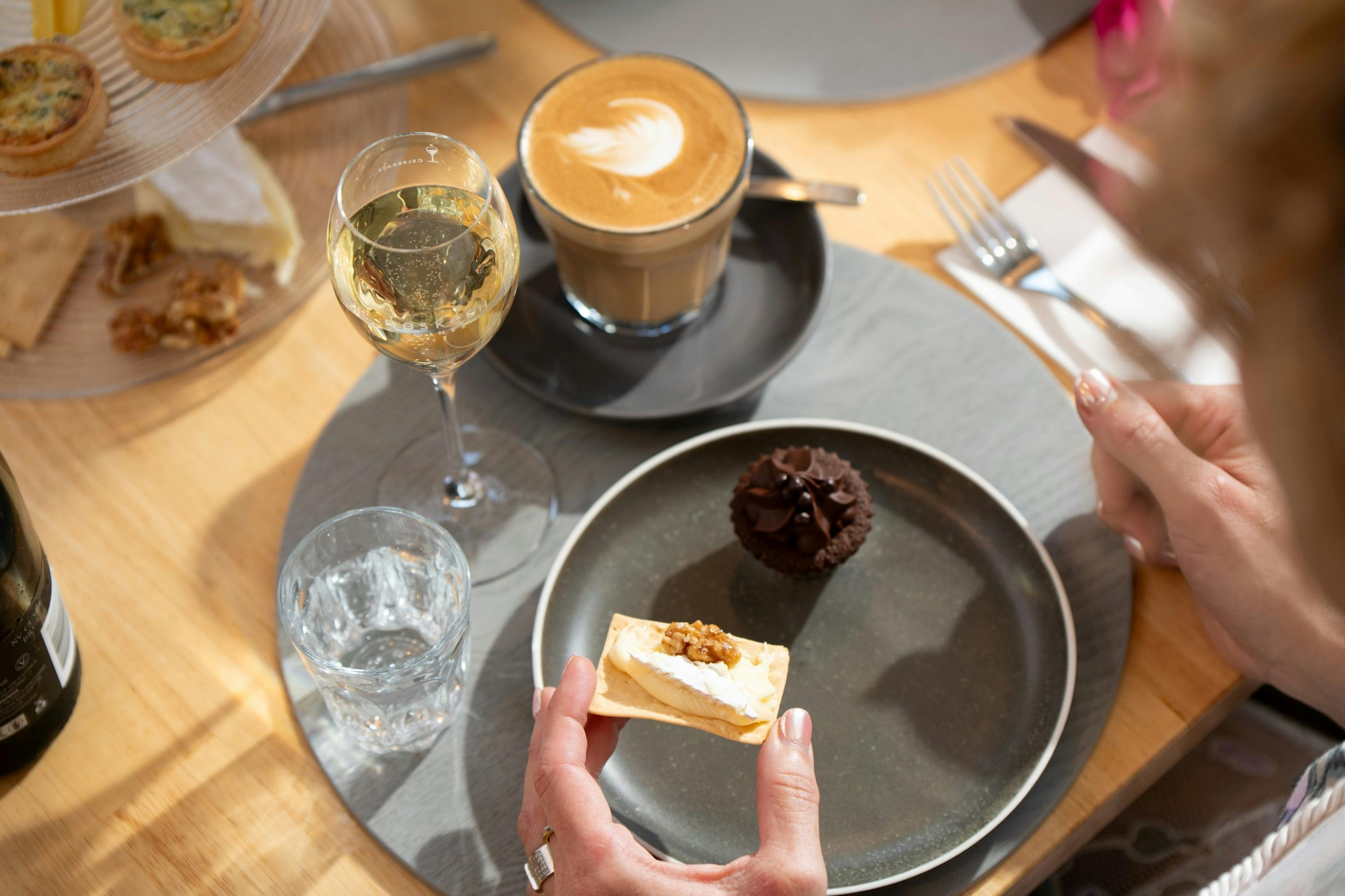 Hand eating high tea
