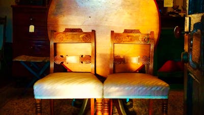 A pair of Mahogany Regency chairs with a Colonial Australian Cedar tilt top table.