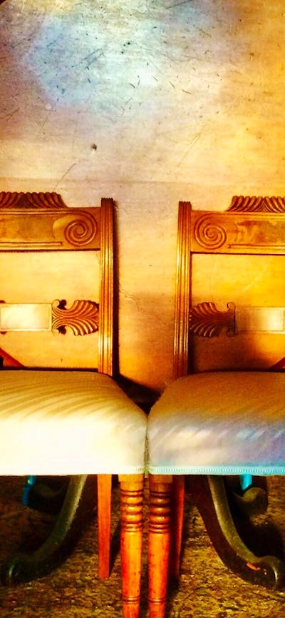 A pair of Mahogany Regency chairs with a Colonial Australian Cedar tilt top table.