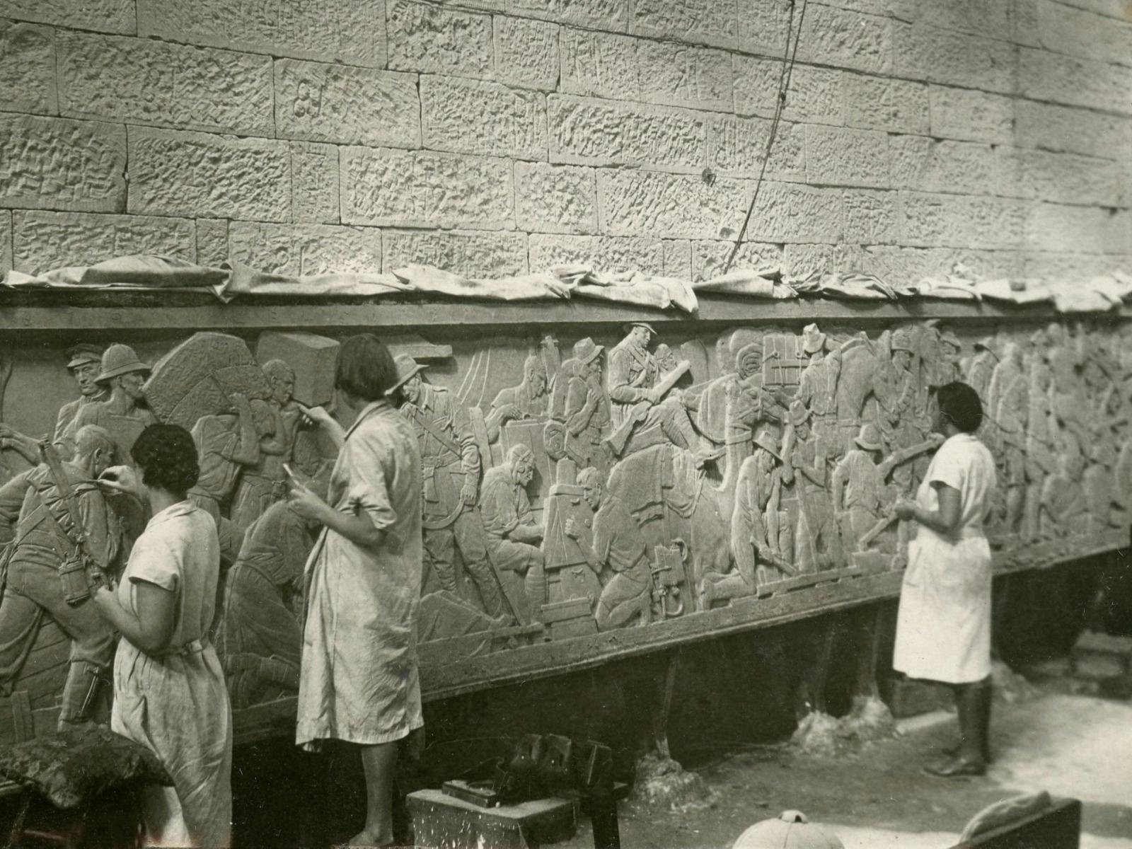 Artists crafting a bas relief depicting the Western Front.