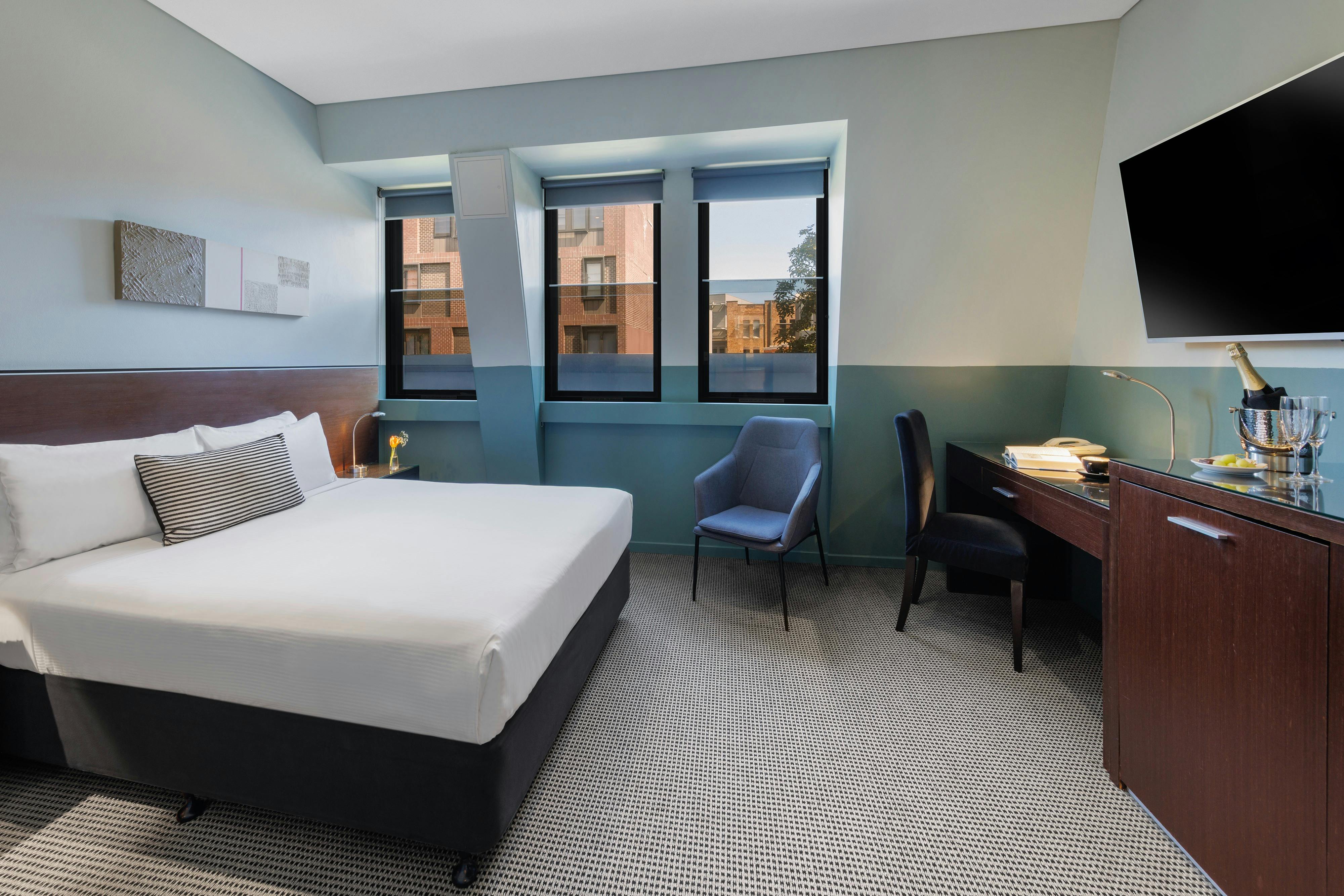 The room with a queen bed.