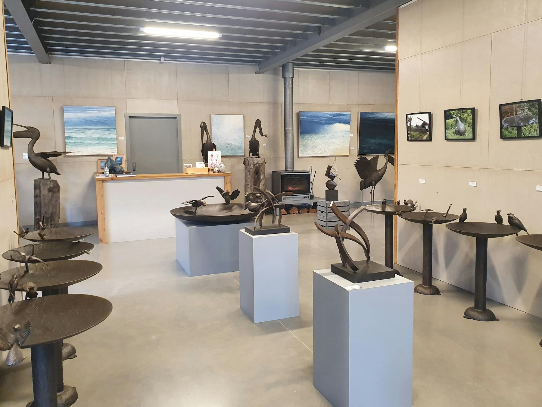 Image of several bronze birdbaths downstairs at The Hive