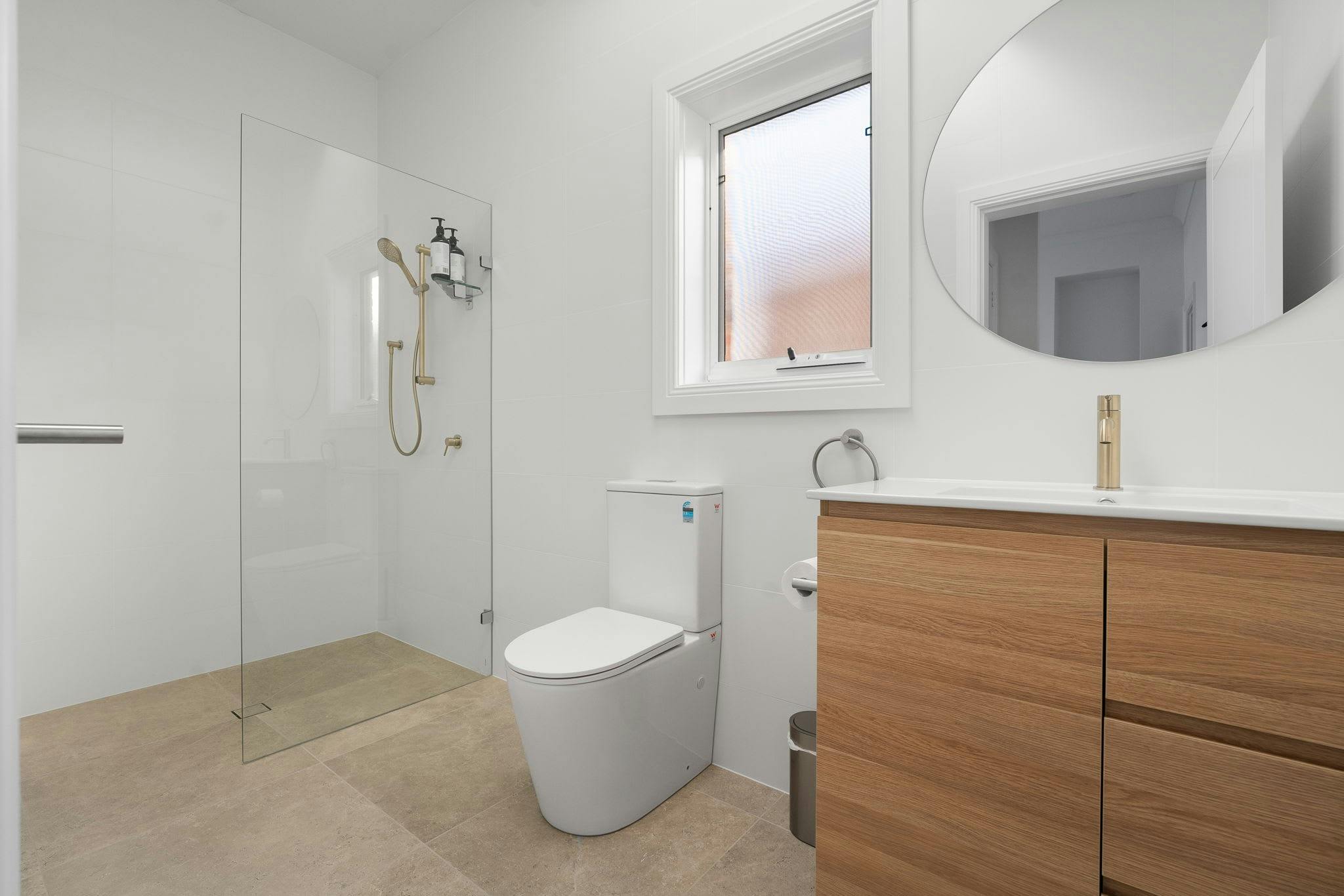 Large bathroom with shower, toilet and vanity
