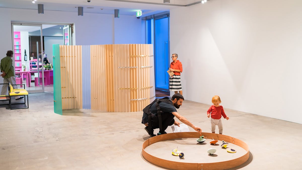 A family playing with sculptures by Celine Condorelli