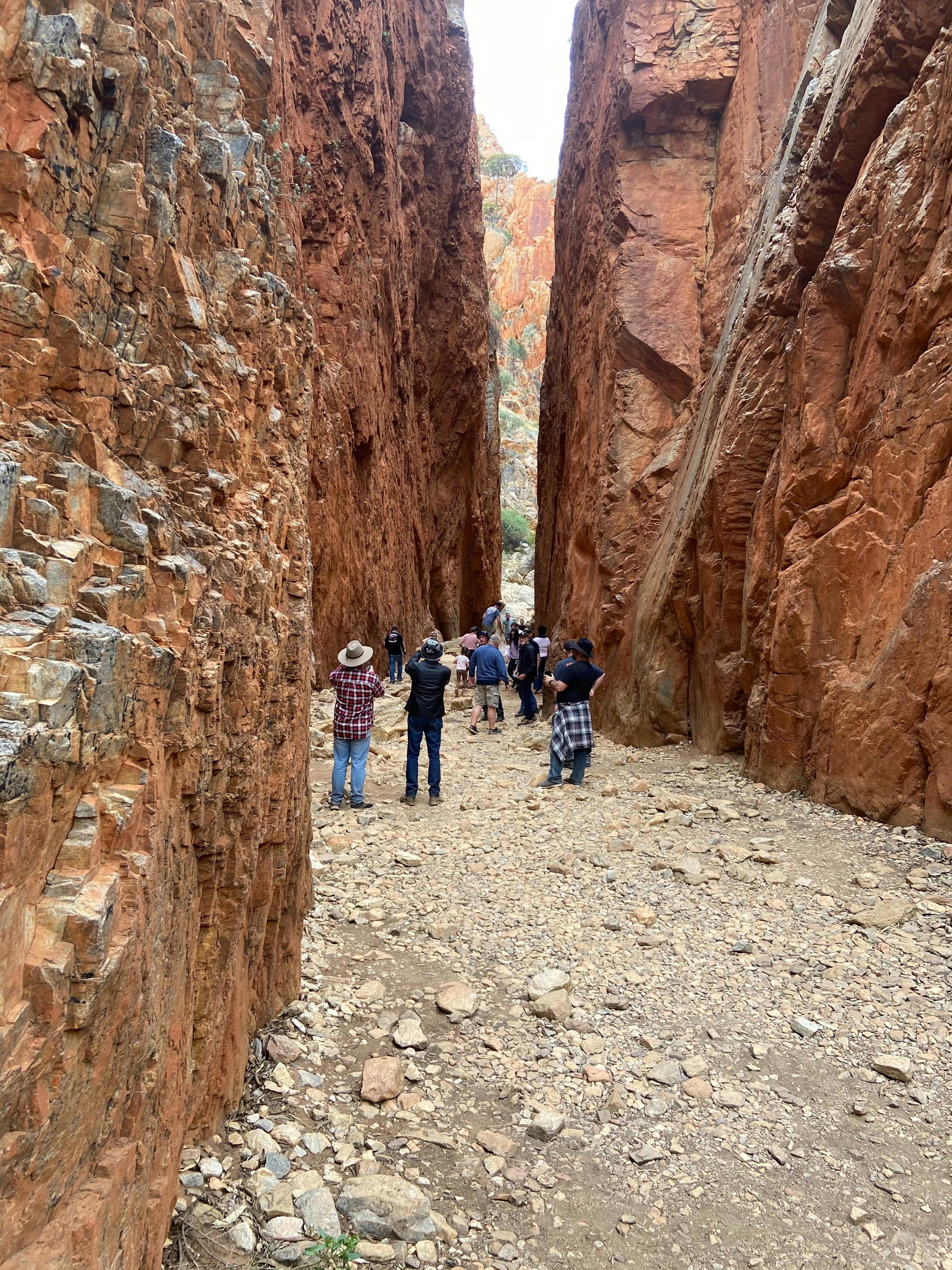a group of people standing in a chasm