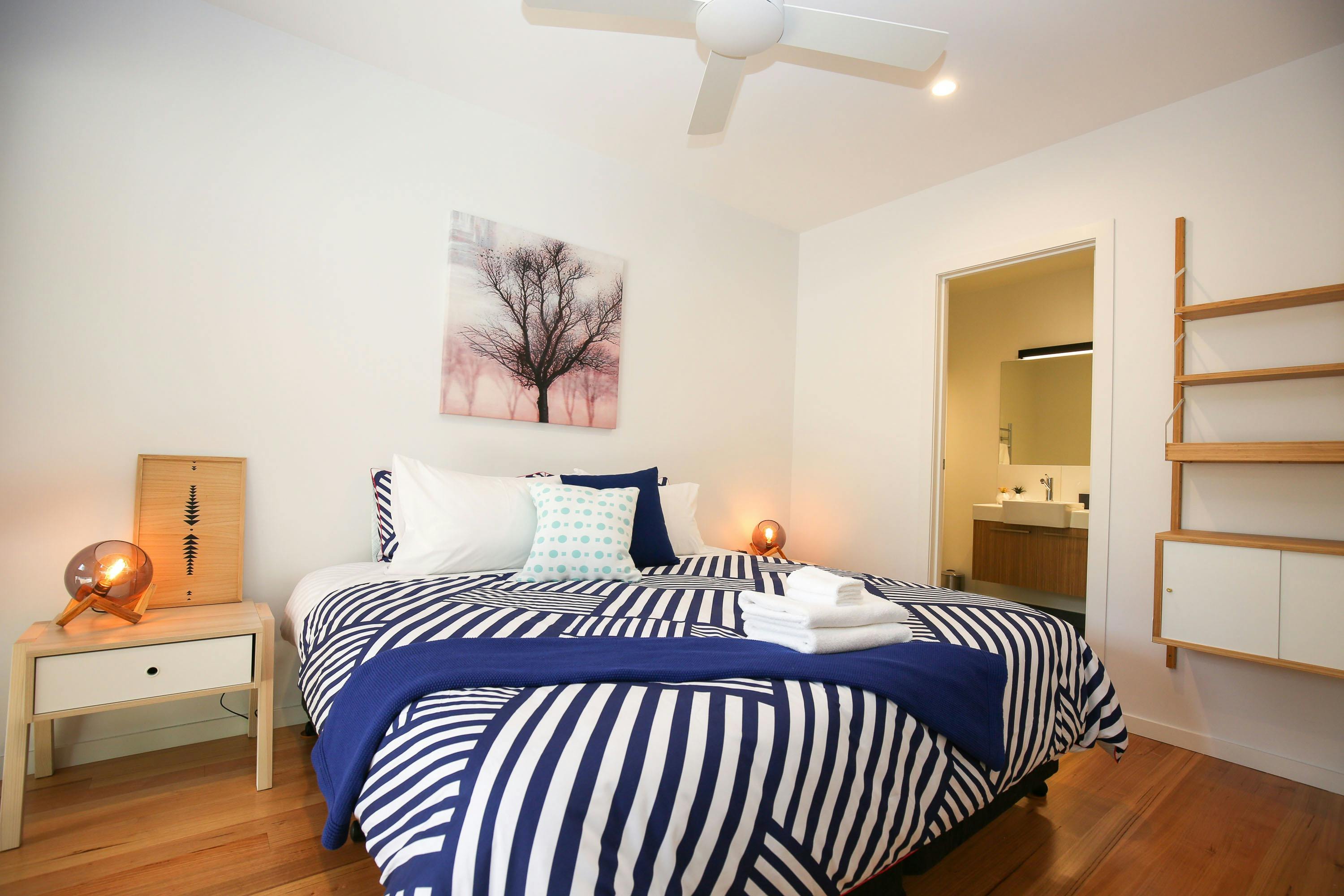 Master bedroom with ensuite at The Stelvio Villas Two Bright Accommodation Alpine Valley Getaways