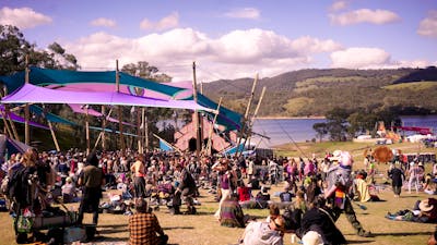 Patrons relaxing to music and a beautiful view.