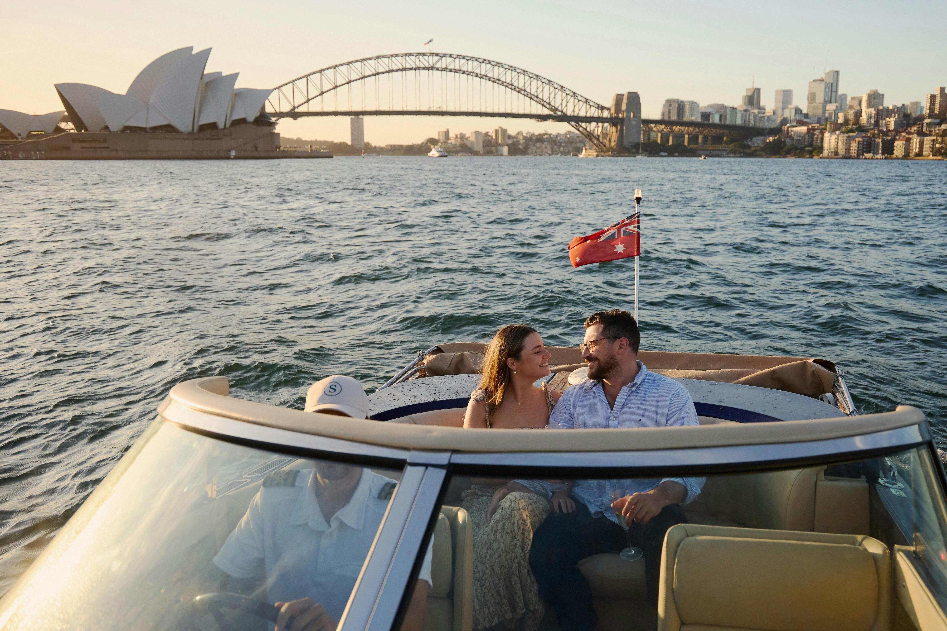 Private boat tour on MV Aquamajestic cruising Sydney Harbour with city skyline views.