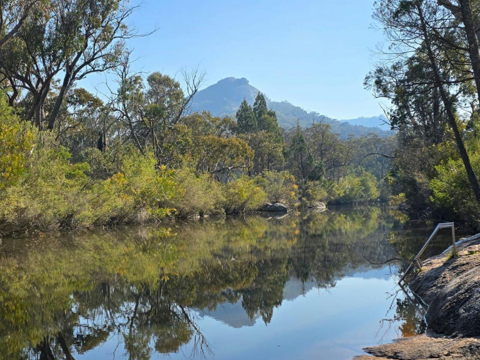 Pyramid shaped mountain behind river