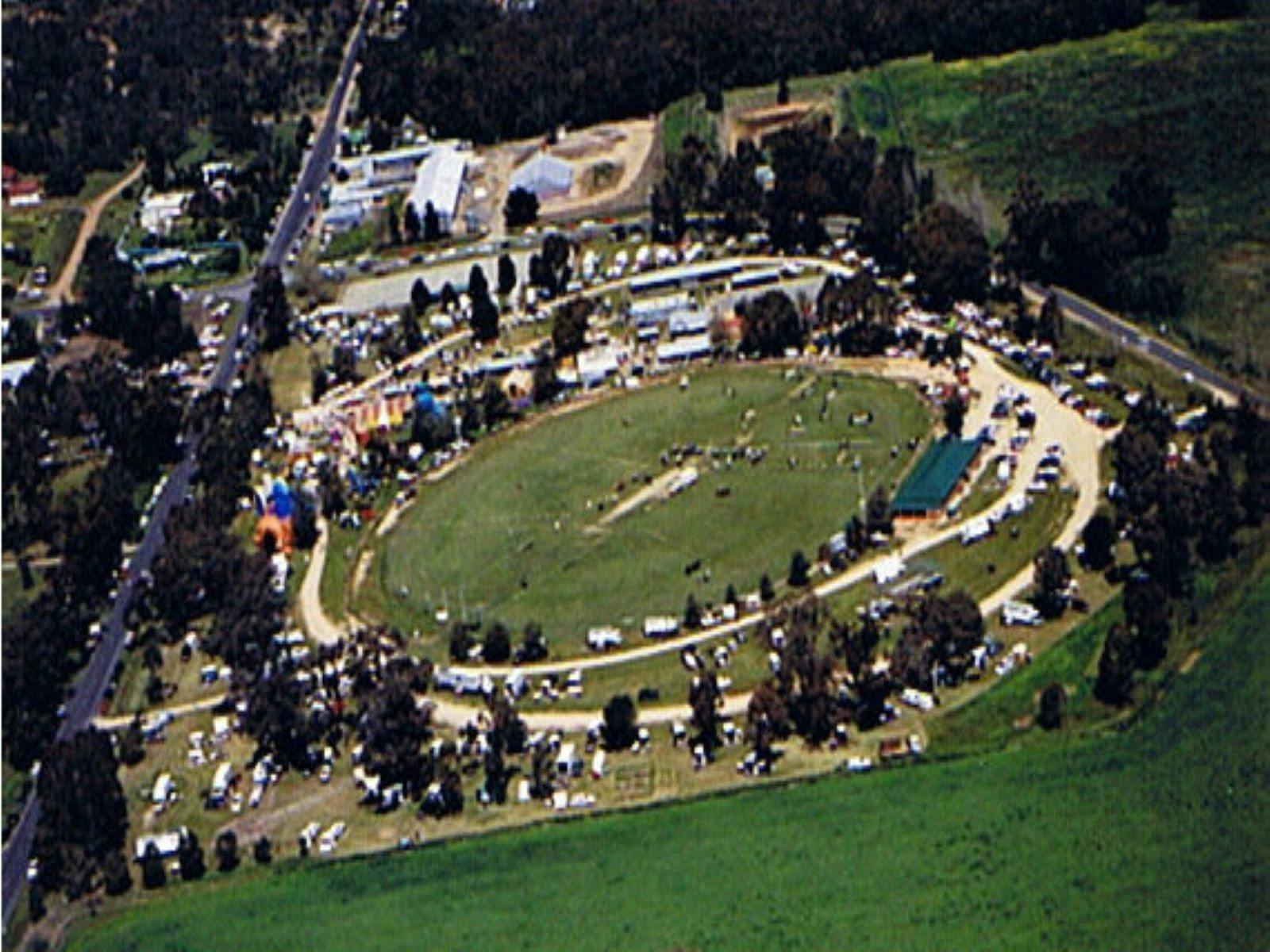 Bird eye view of the Walbundrie Show, rides tents, animals and people can be seen.