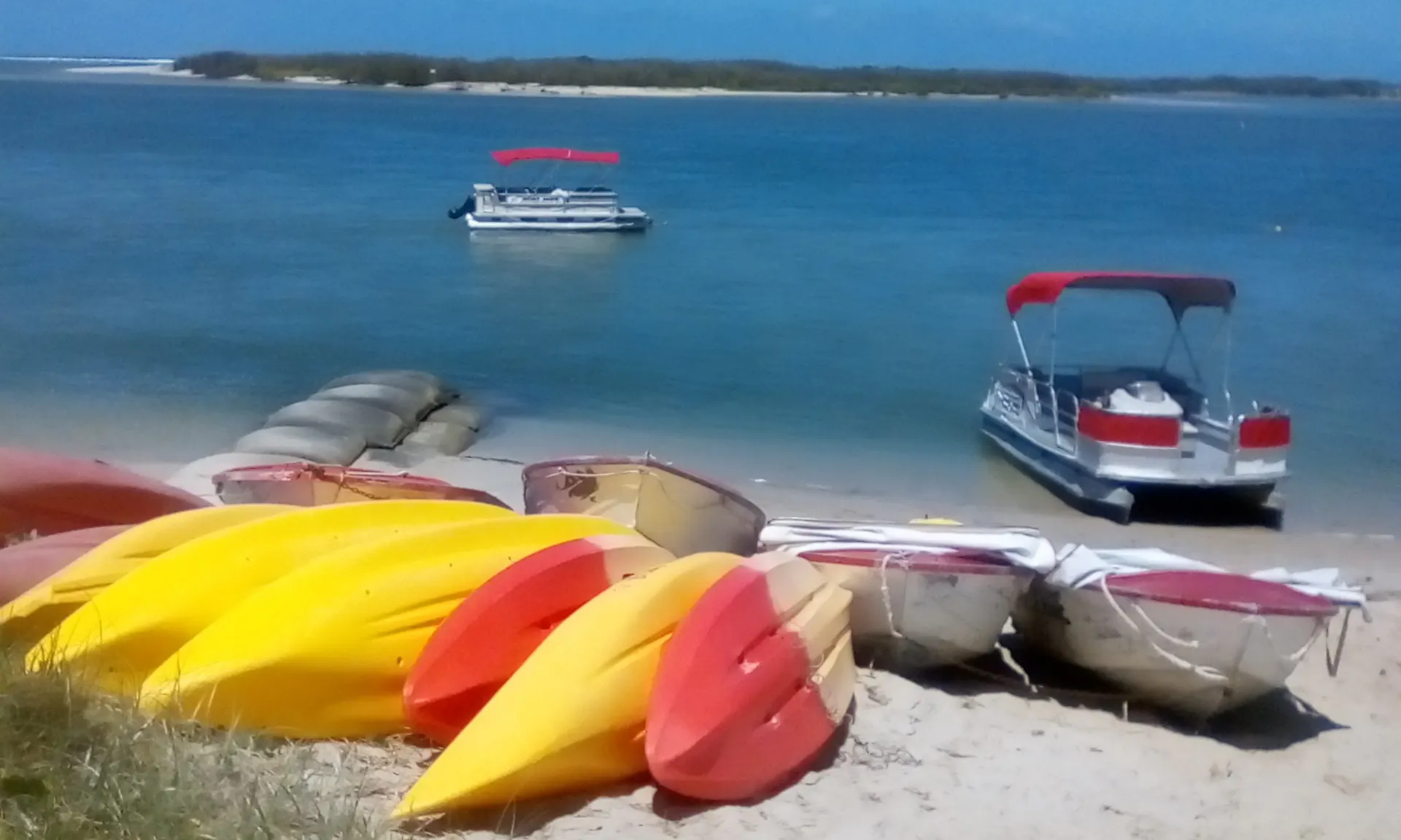 Pontoon Boat on the Beach ready for hire in the beautiful Pumicestone Passage, Caloundra