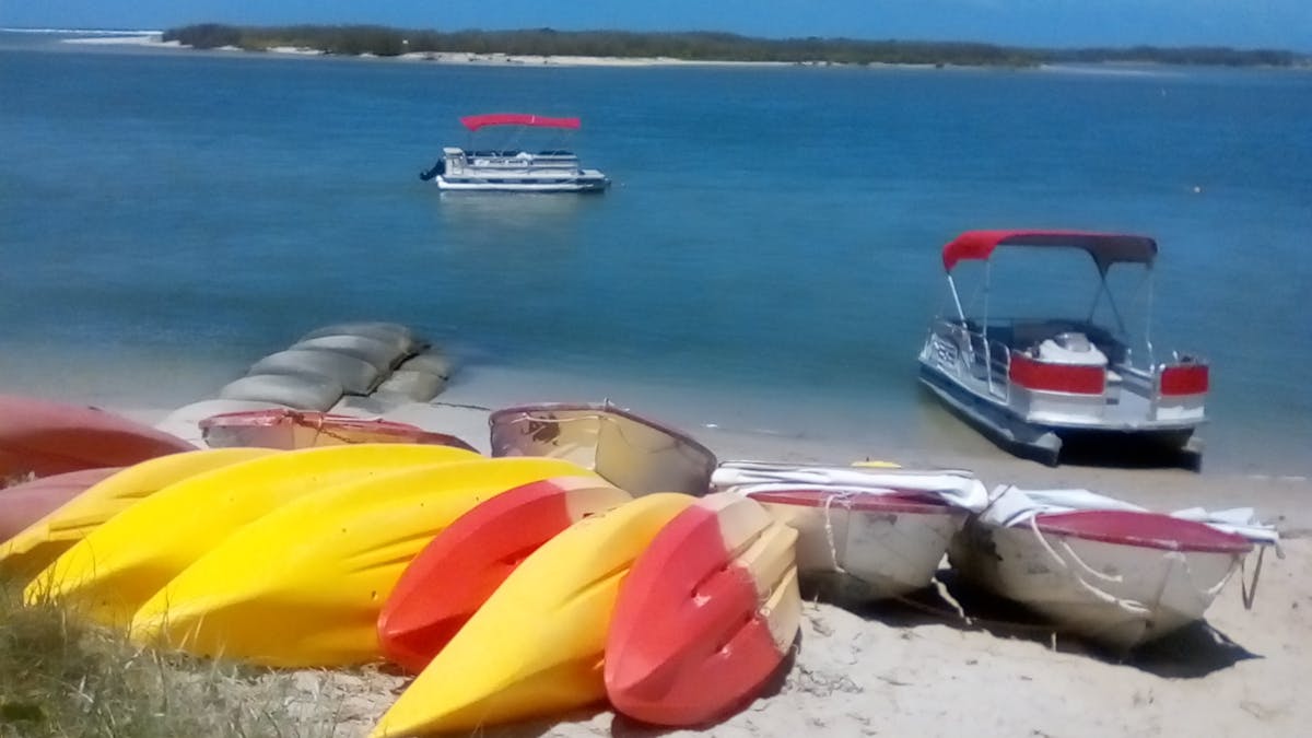 Pontoon Boat on the Beach ready for hire in the beautiful Pumicestone Passage, Caloundra