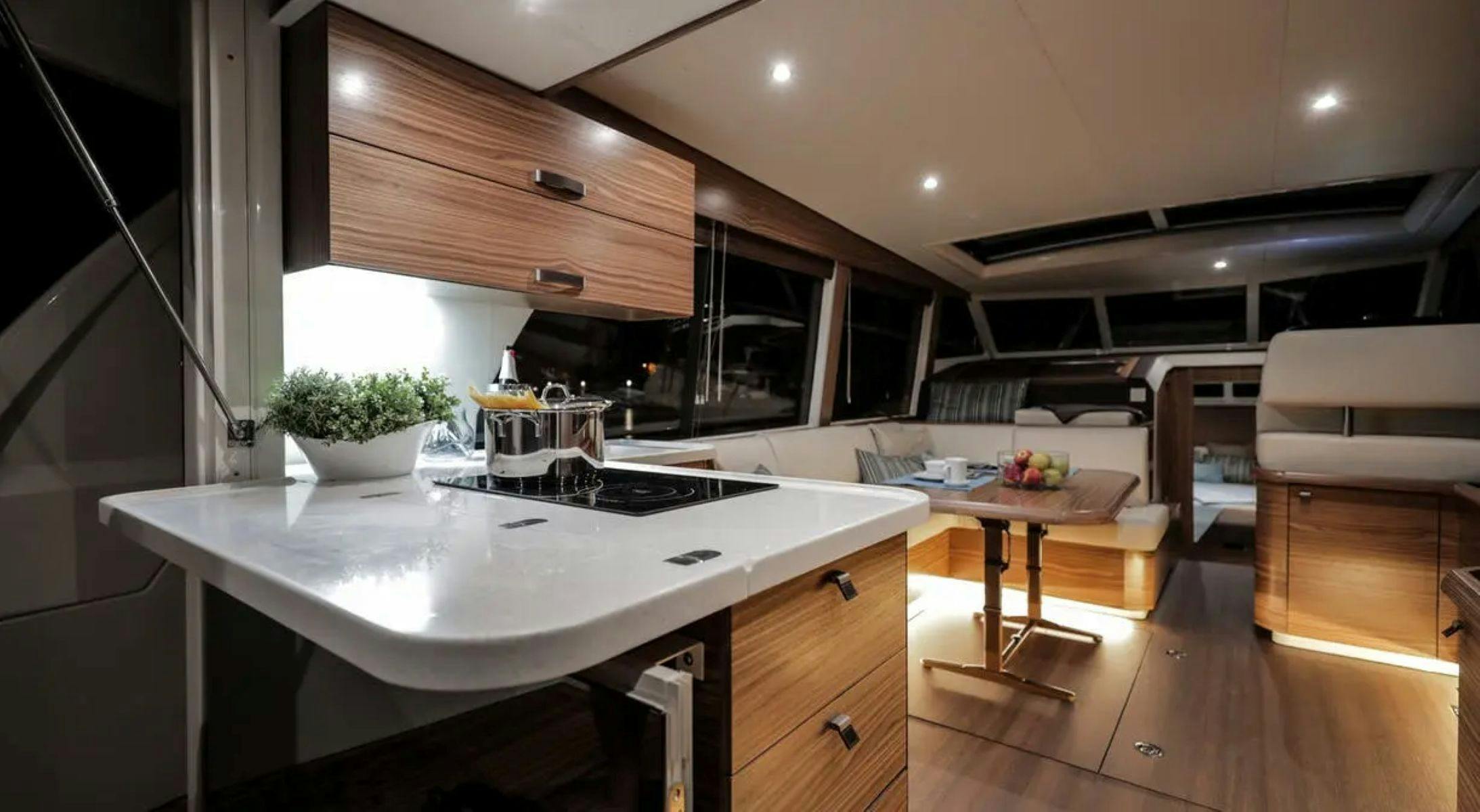 Luxury yacht saloon and galley interior aboard EV Arcadia electric cruiser Sydney