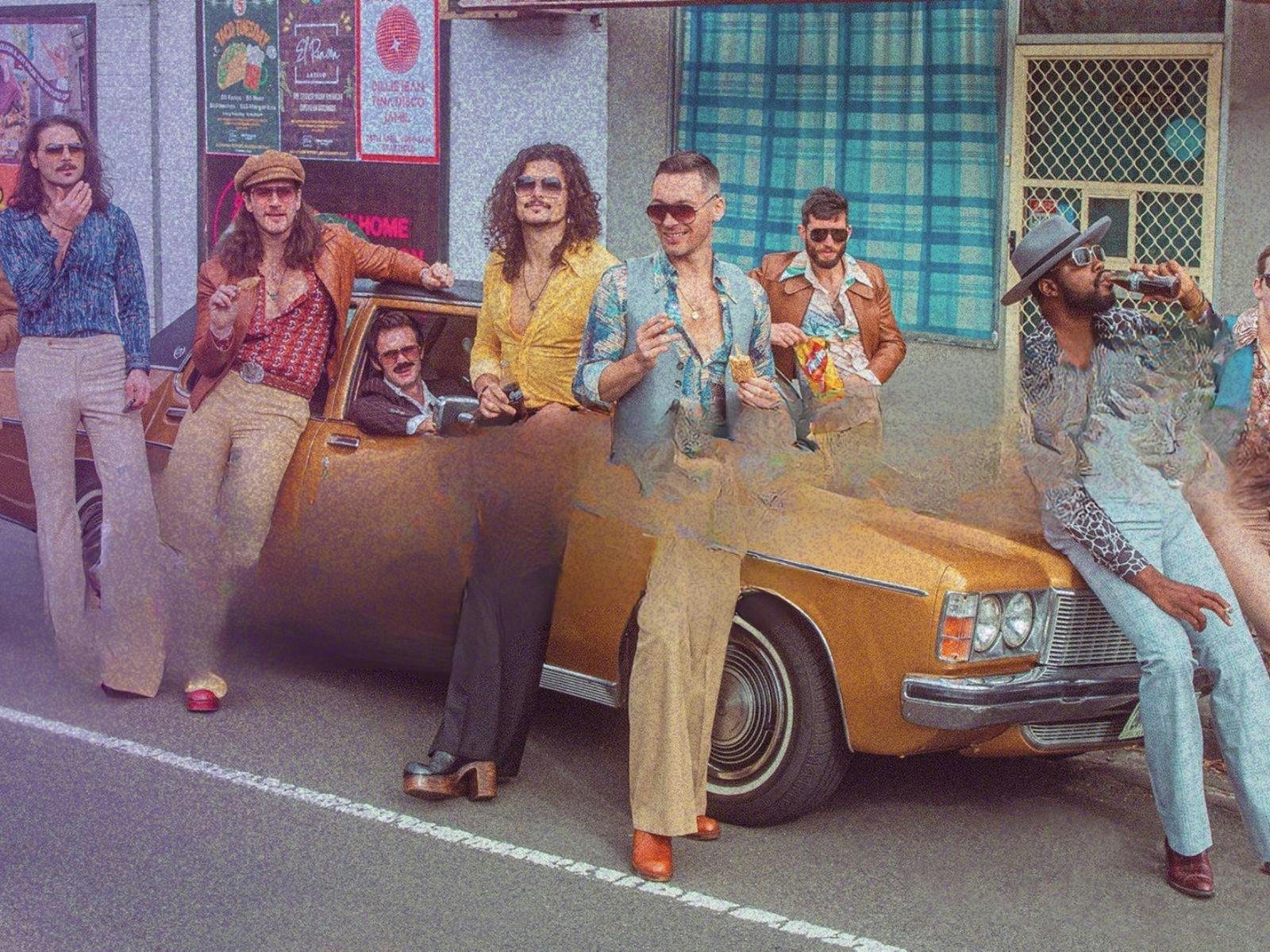 vintage photo of Yachtski band members against car