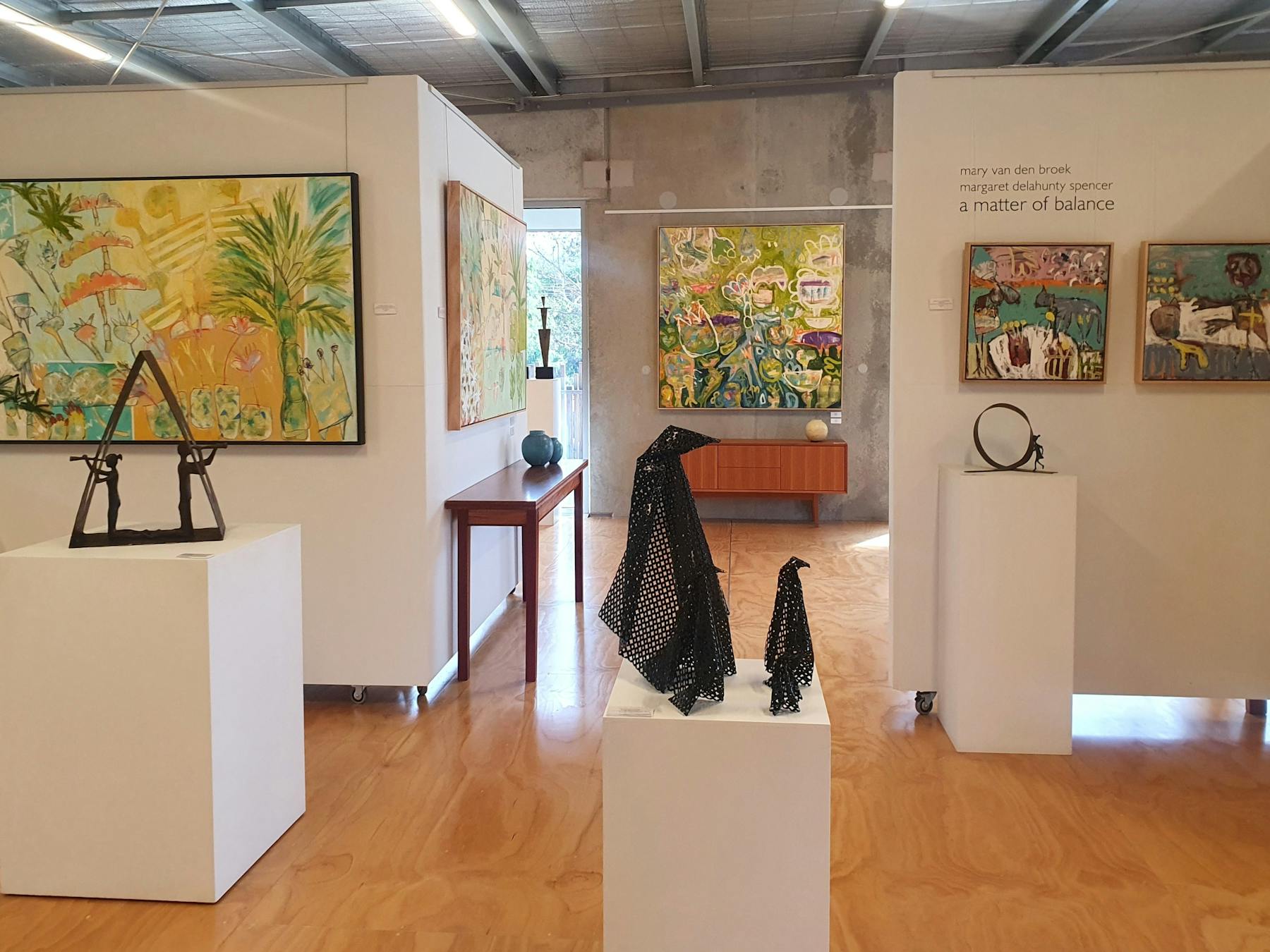 Image of abstract paintings and sculpture upstairs in Hive Gallery
