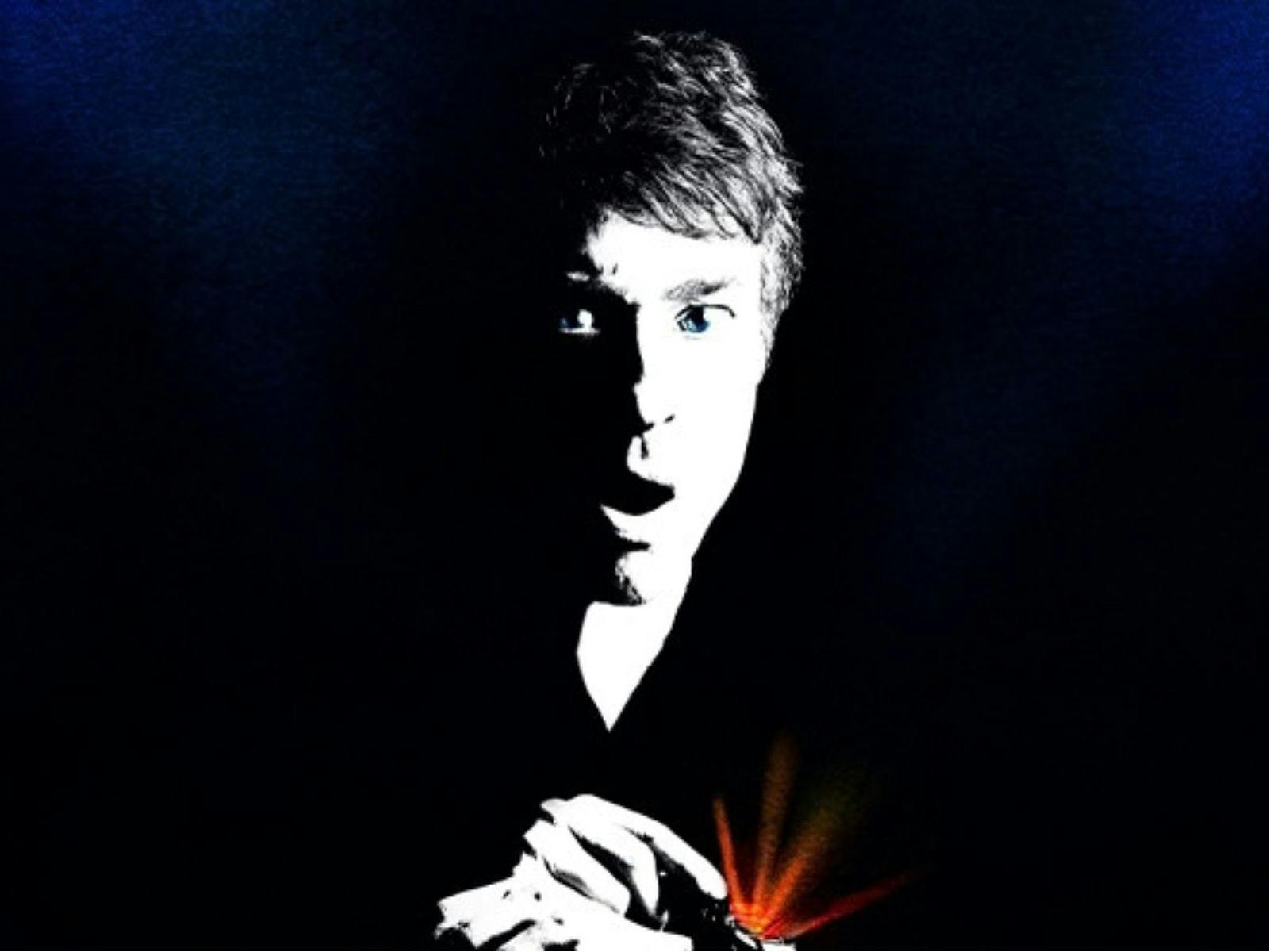 dark background with black and with profile of Arj