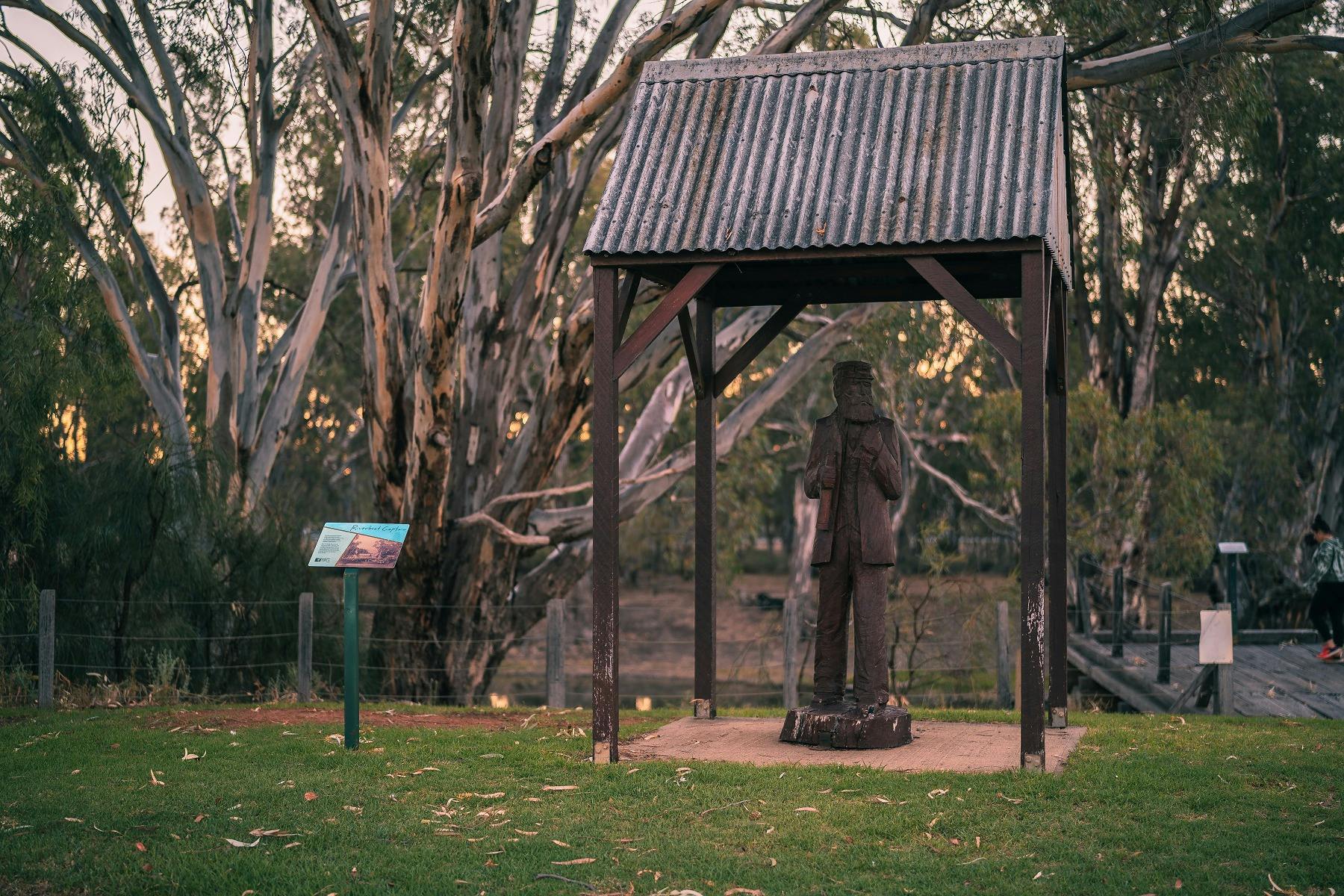 Wooden sculpture of riverboat captain