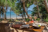 Outdoor dining at Nala Resort, Tropical drinks, curated wine list with views of Dunk Island