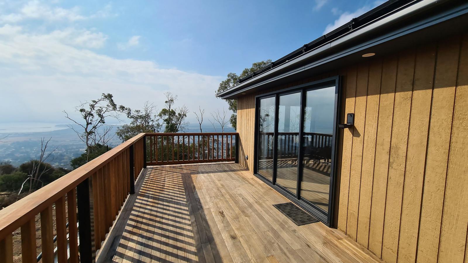 Private outdoor deck overlooking the surrounding bushland