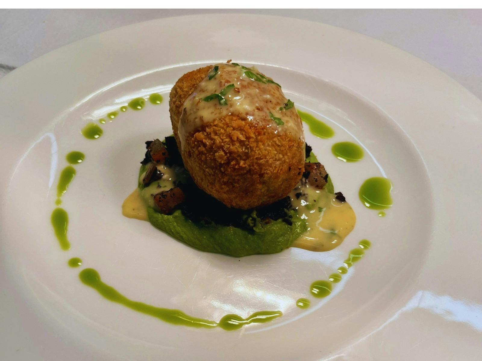 Crispy Pork Croquettes served on pea puree with