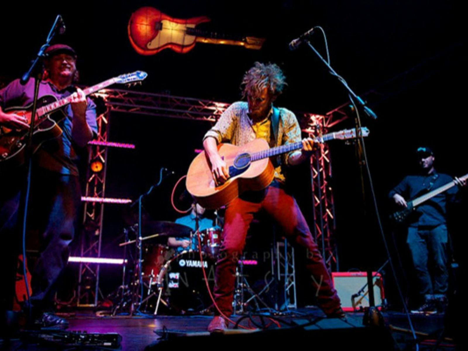 Image of a band performing on stage