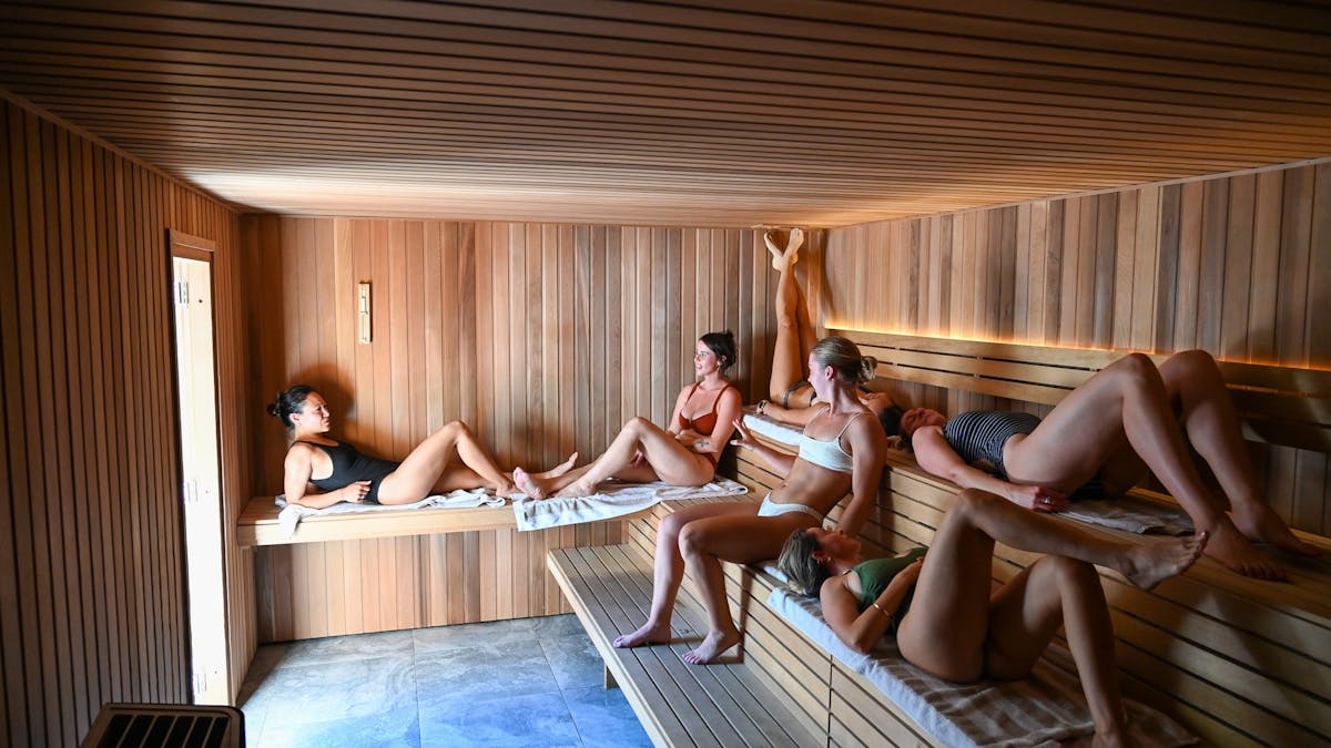 Six guests relaxing in the sauna