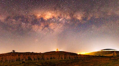 The Arboretum Village Centre with stars in the night sky.