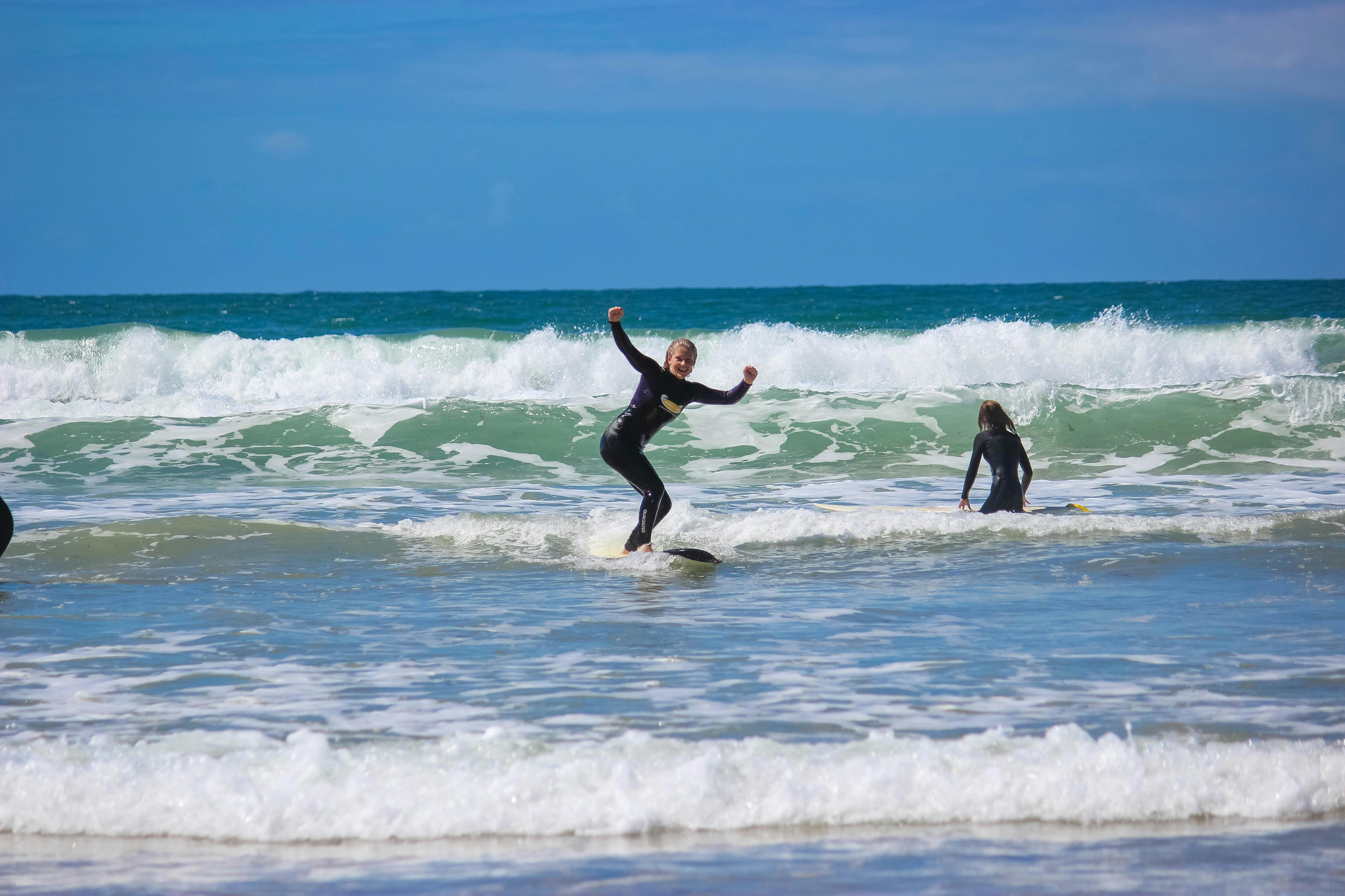 a surfer on a surfboard on a wave